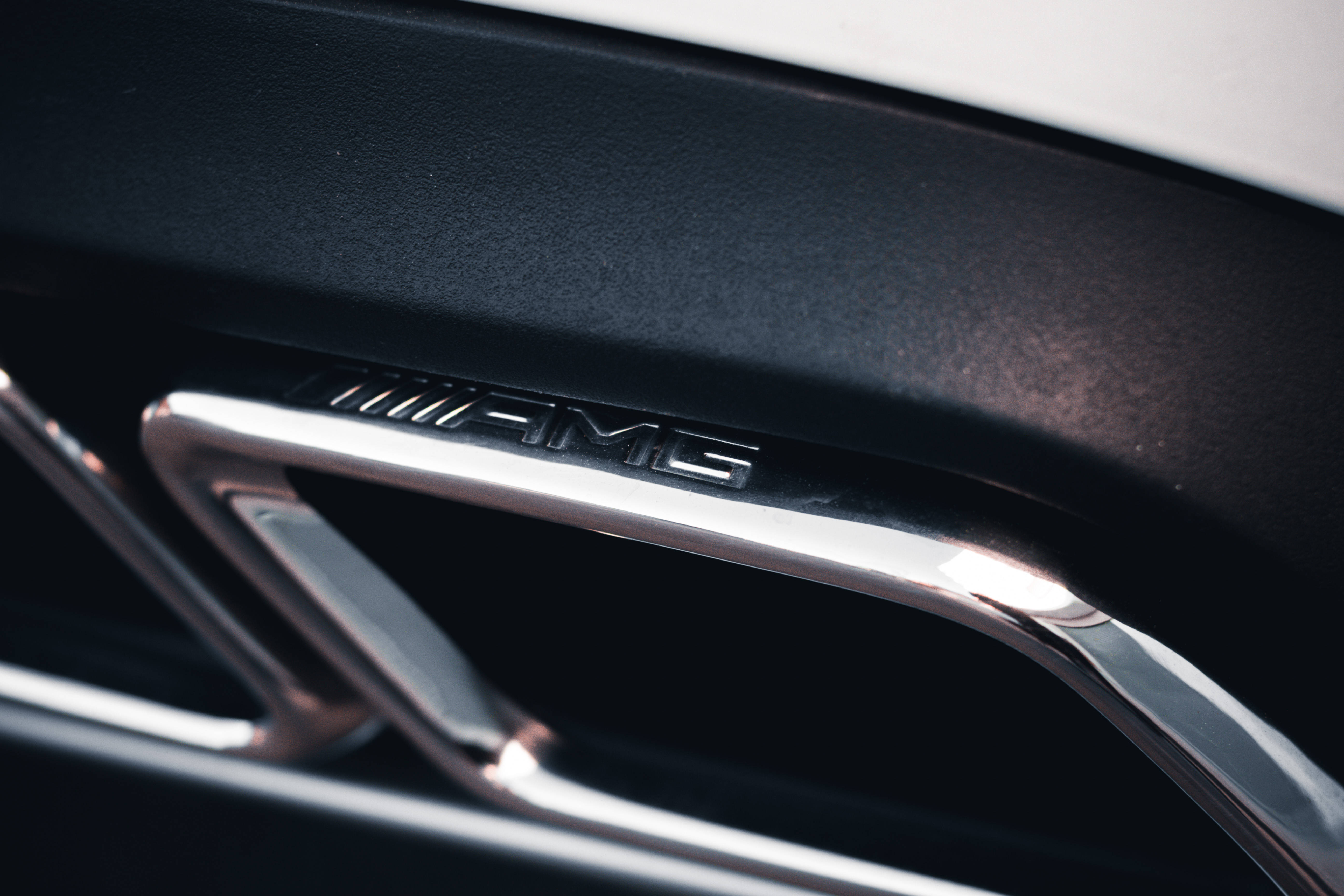 Mercedes AMG, chromed emblem, black car interior trim, 5K Desktop Wallpaper