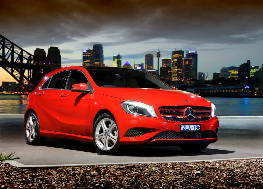 Mercedes-Benz A-Class, vibrant red, city skyline, SD Desktop Wallpaper