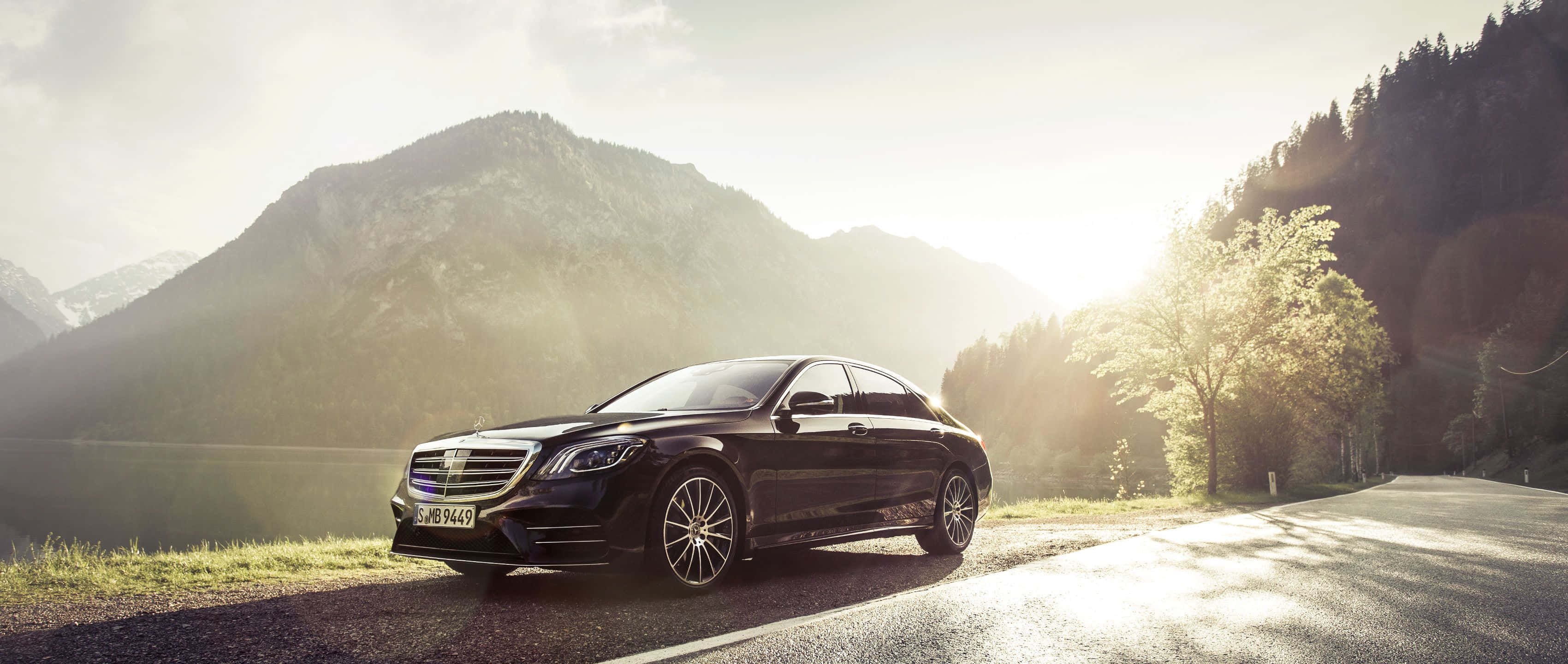 Mercedes Benz S-Class, sleek black, winding mountain road, 2K Desktop Wallpaper