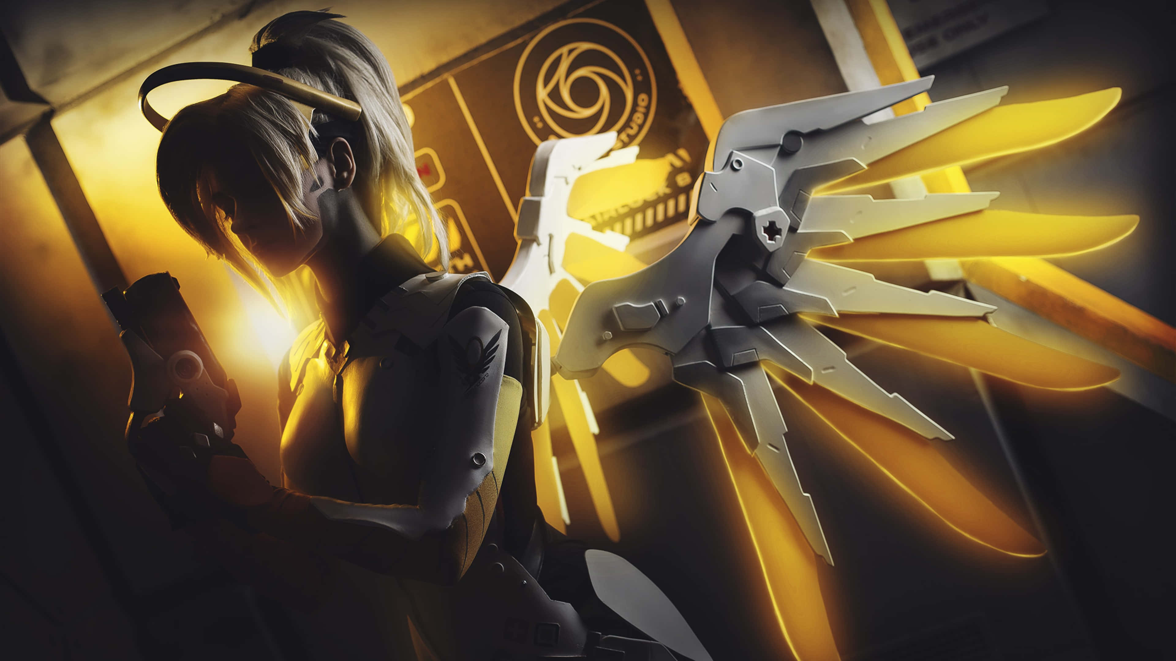 Mercy Overwatch, glowing golden wings, mechanical arm, 4K Desktop Wallpaper