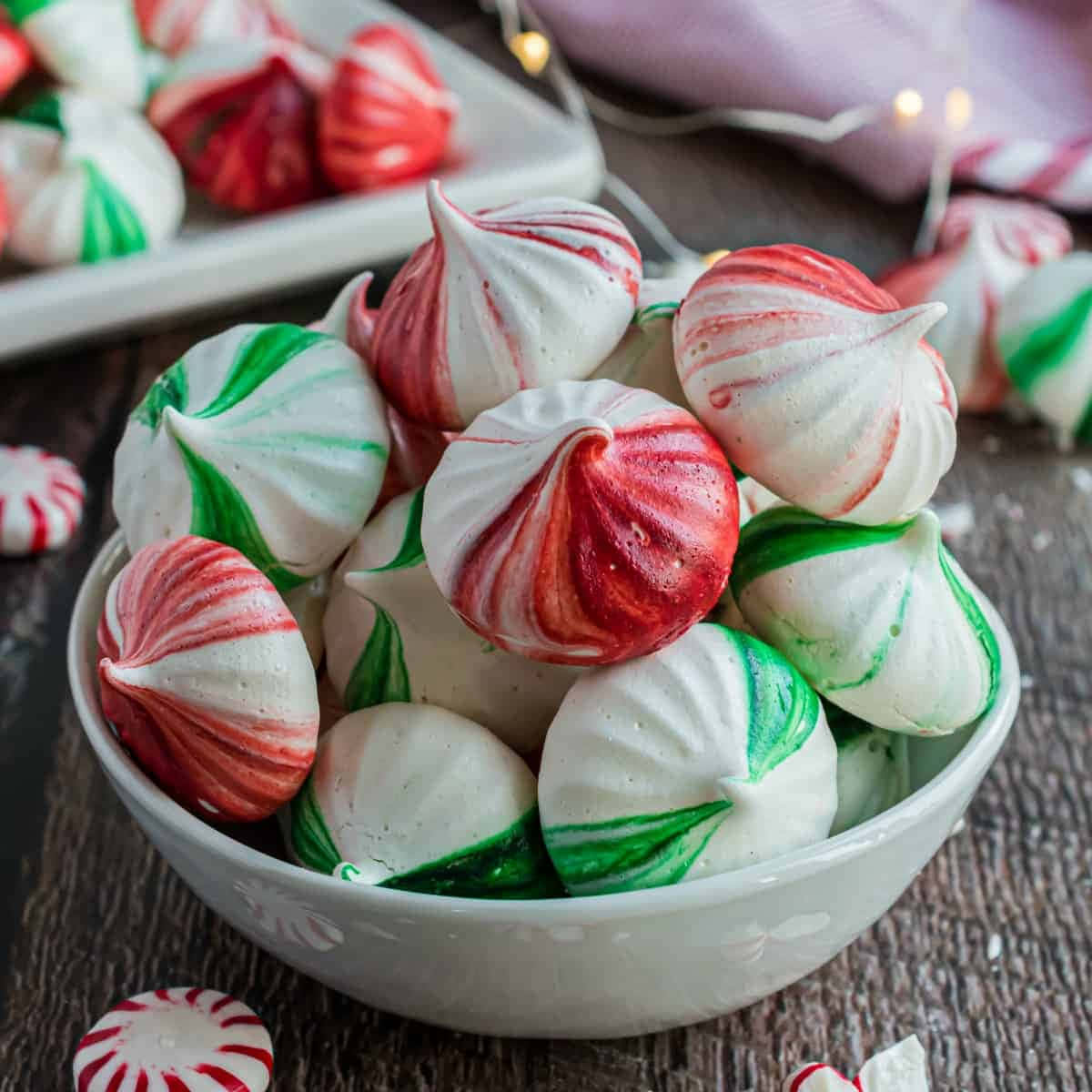 Meringue, festive red green and white swirled meringue kisses, rustic wooden table, SD Desktop Wallpaper