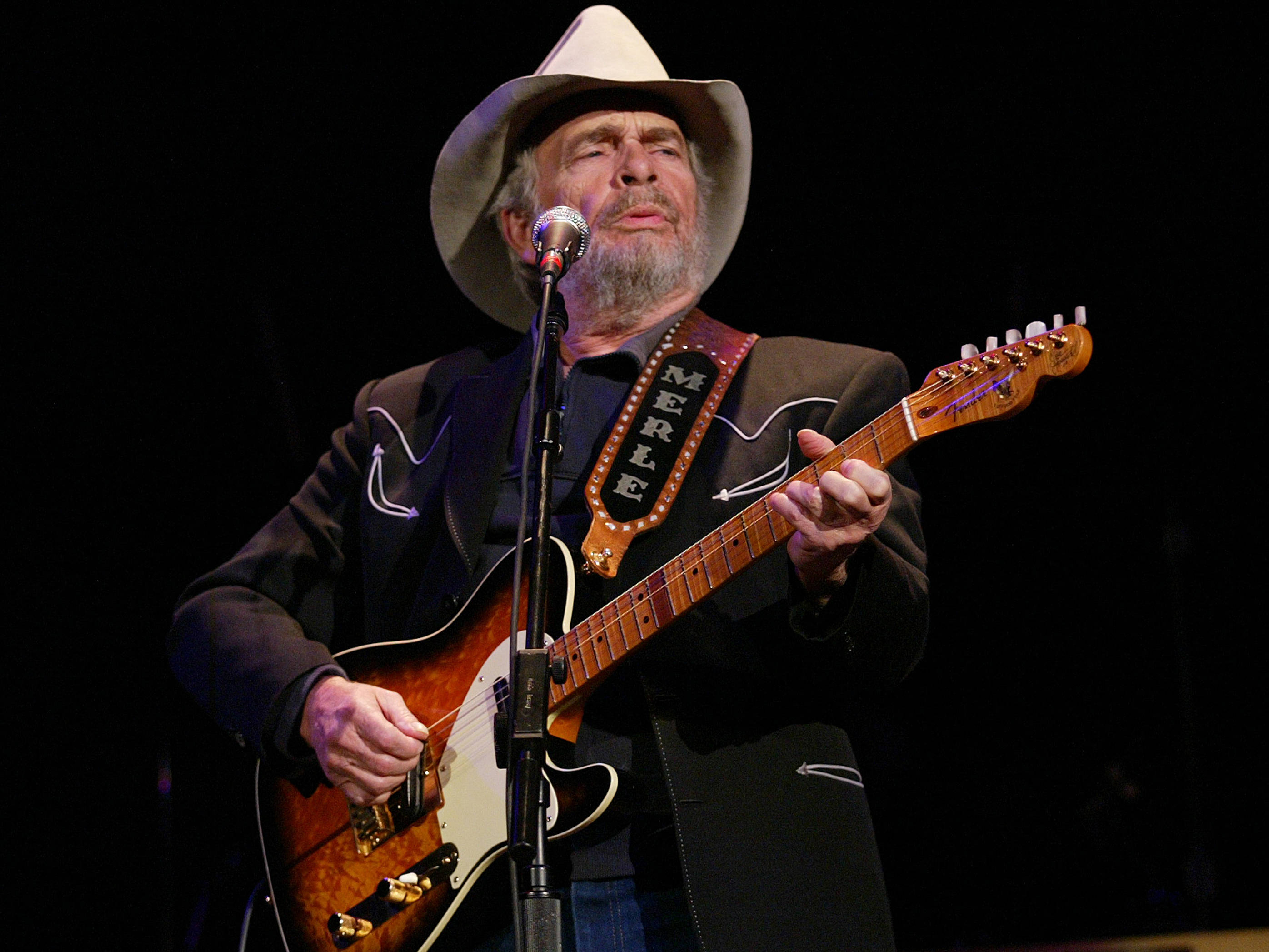 Merle Haggard, cowboy hat, guitar, 2K Desktop Wallpaper