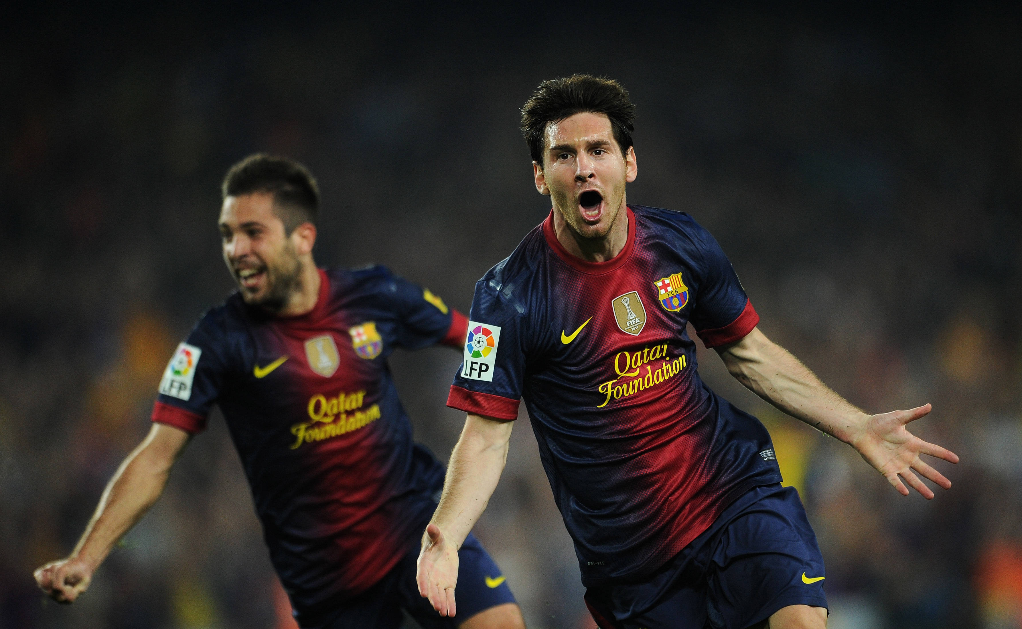 Messi 4K Ultra HD, red and blue jerseys, brightly lit stadium field, 2K Desktop Wallpaper