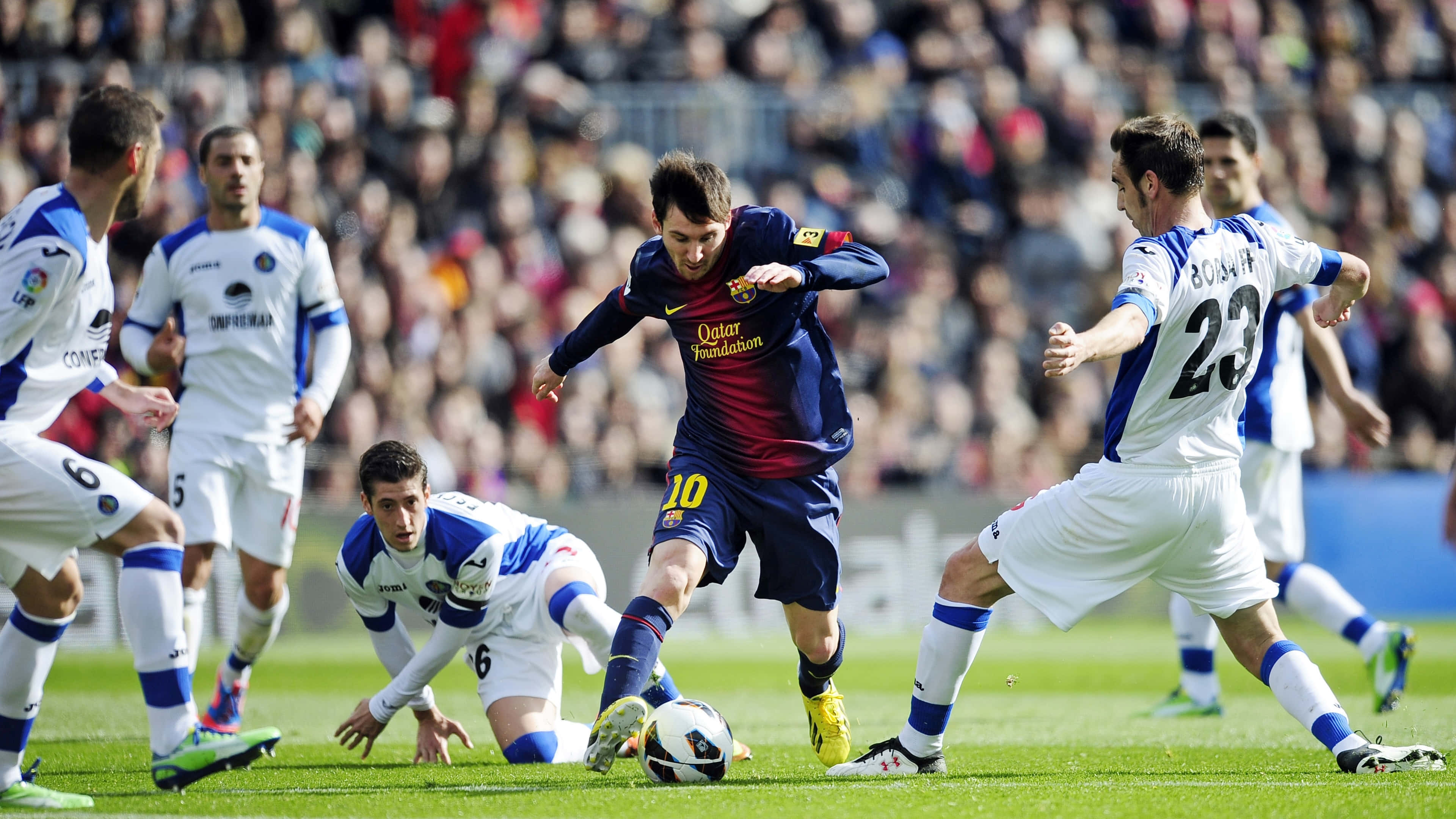 Messi, blue and red striped jersey, sunlit green pitch, 4K Desktop Wallpaper