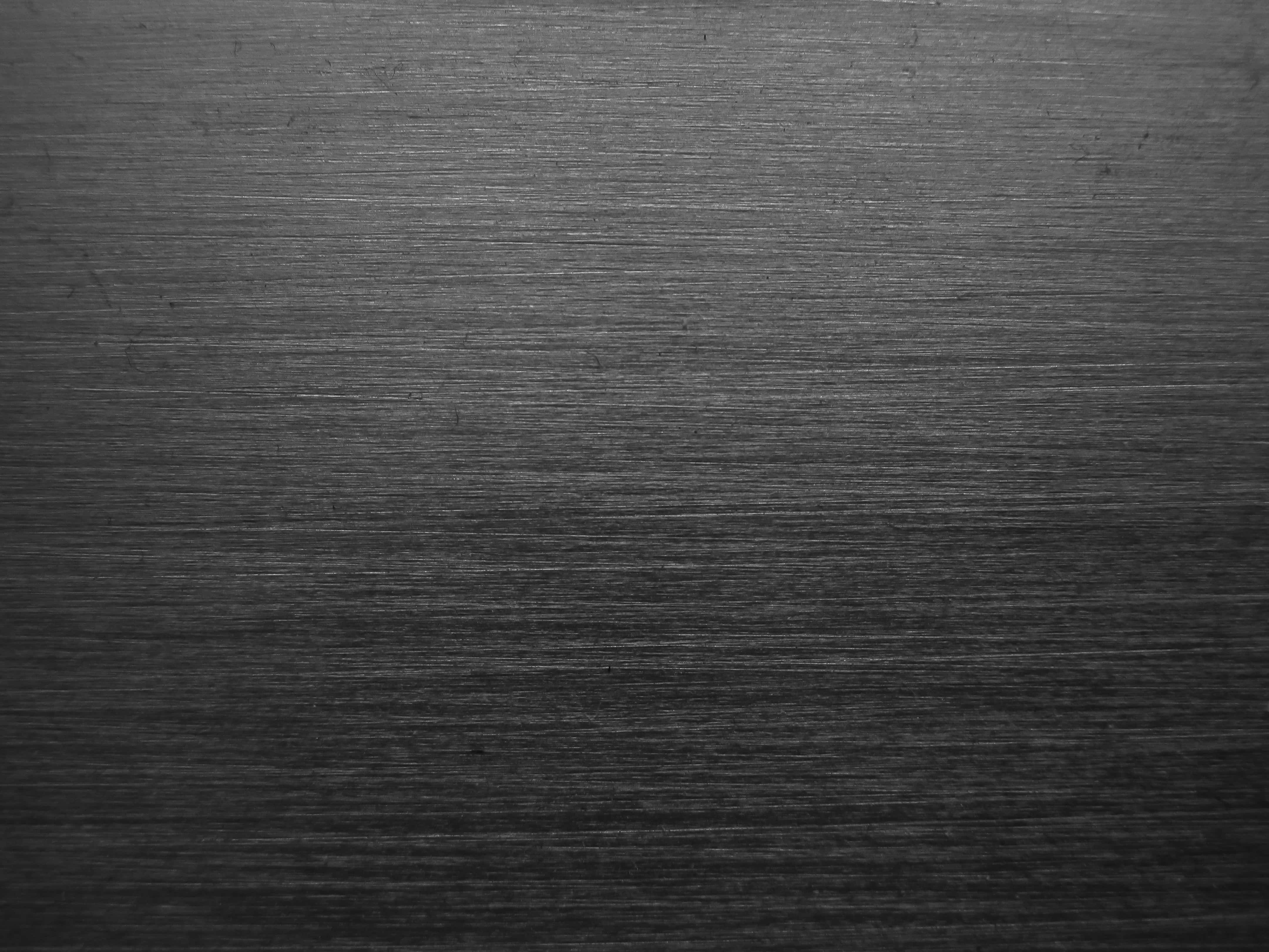 black metal texture, brushed metal surface, fine parallel lines, 4K Desktop Wallpaper