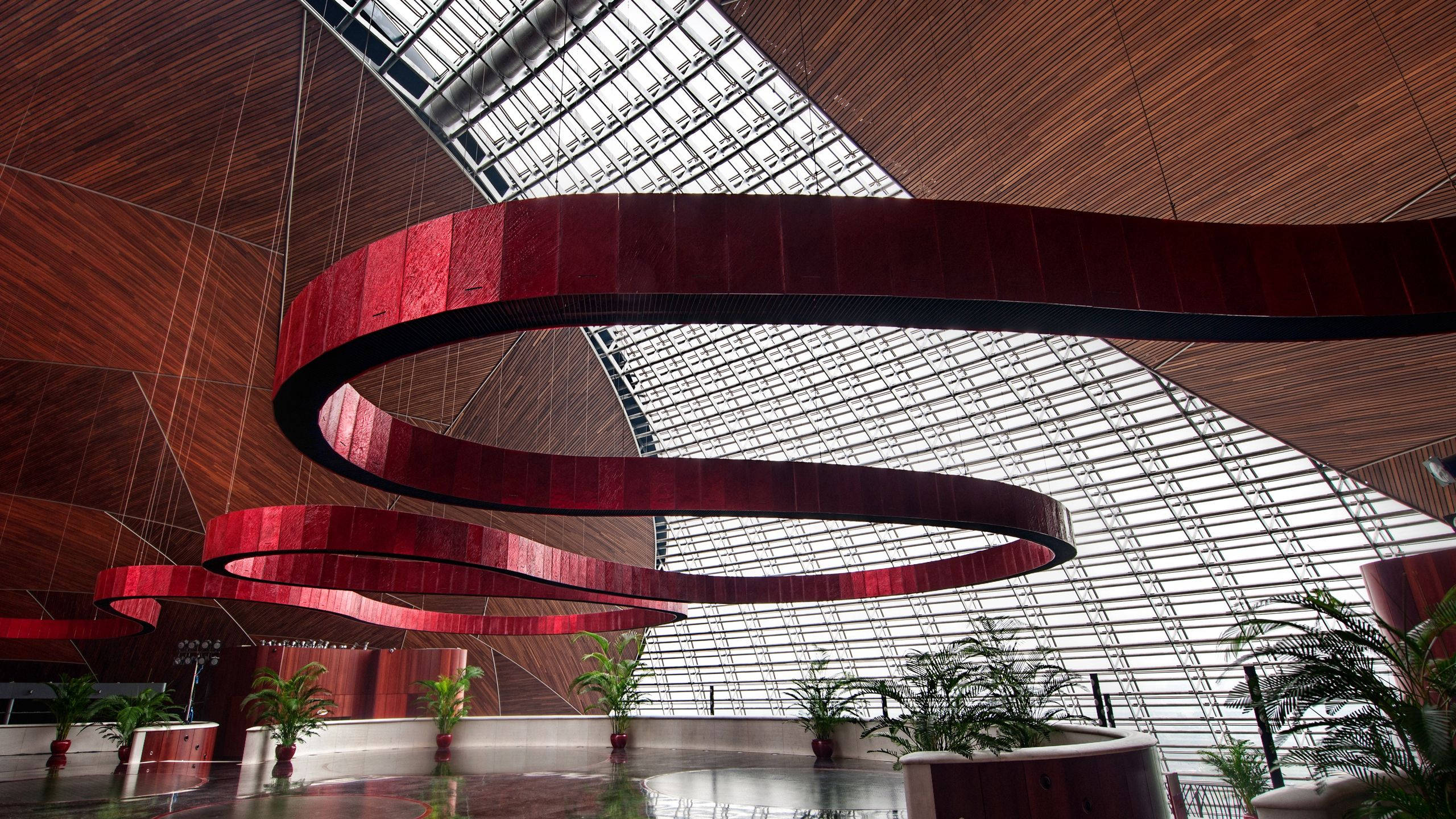 metallic metal strip decoration, swirling red metallic sculptures, glass and wood ceiling, 2K Desktop Wallpaper
