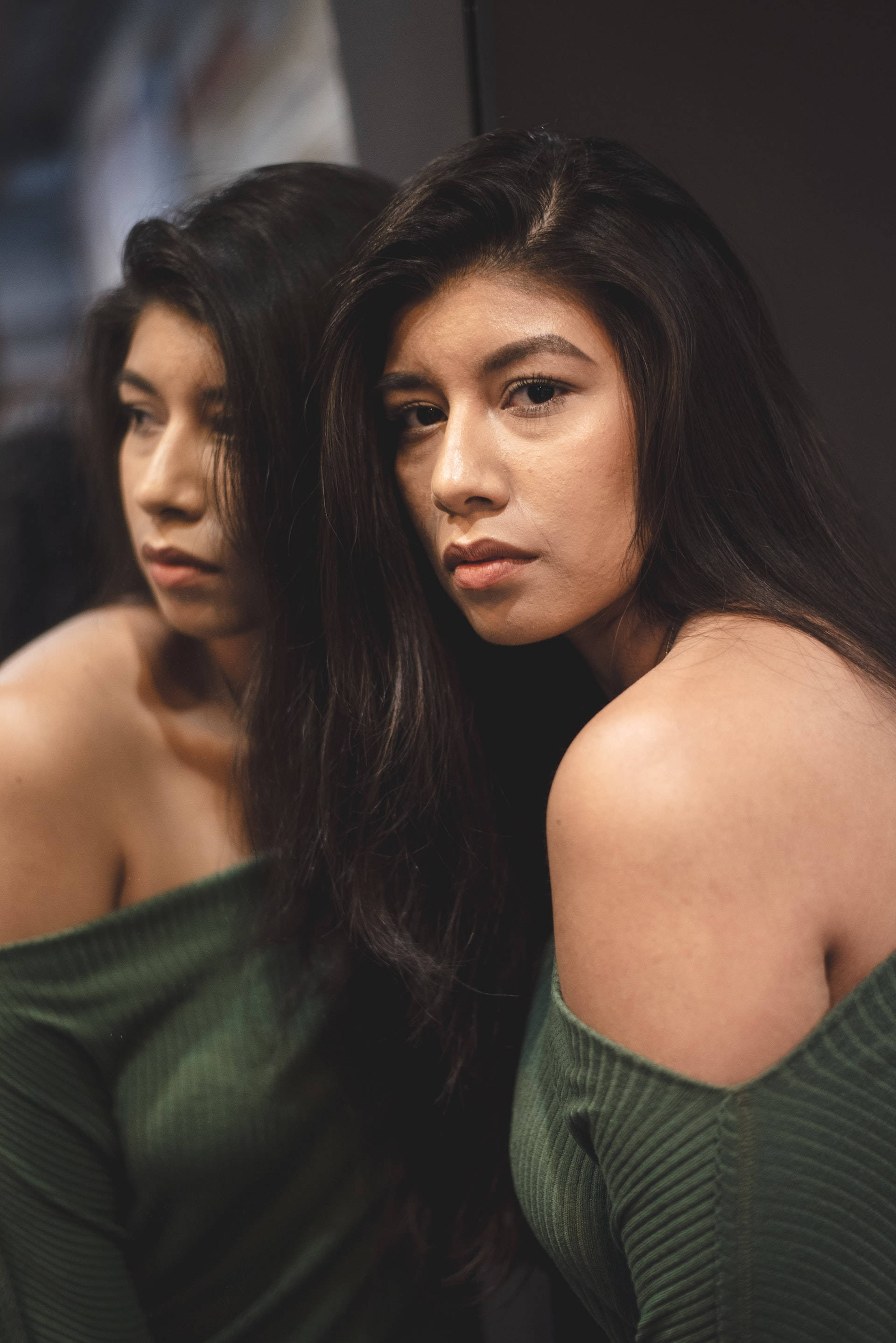 Mexican Girl Mirror, long dark hair, somber expression, 2K Phone Wallpaper