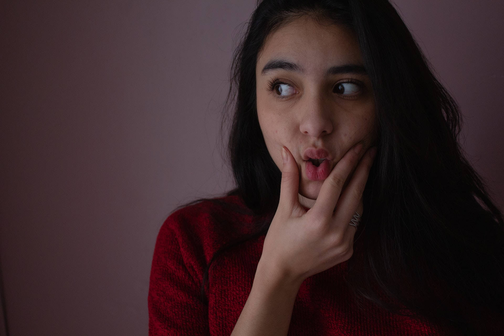 Puckering Mexican Girl, red sweater, wide eyes, Full HD Desktop Wallpaper