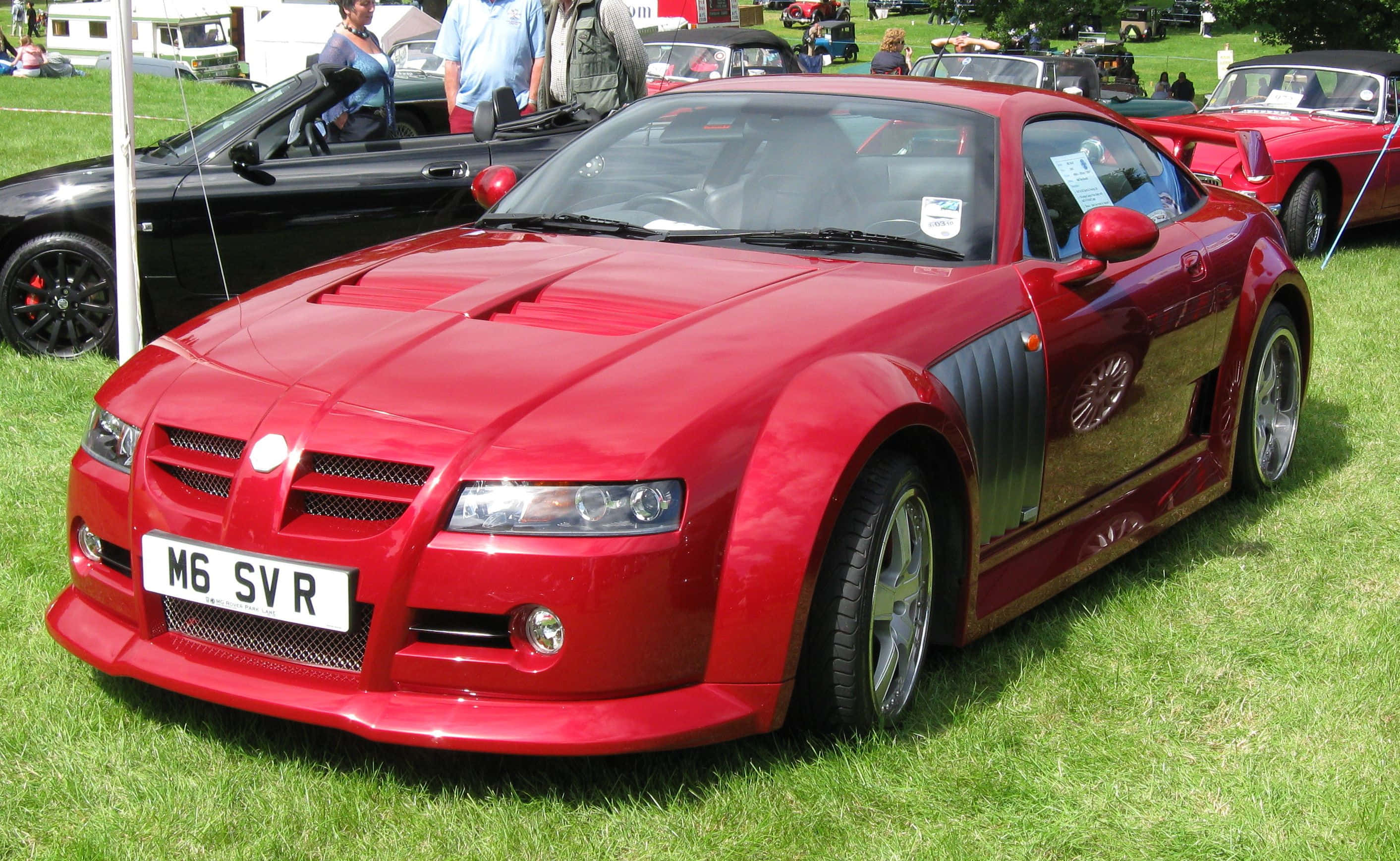 MG XPower SV, glossy red, black accents, 2K Desktop Wallpaper