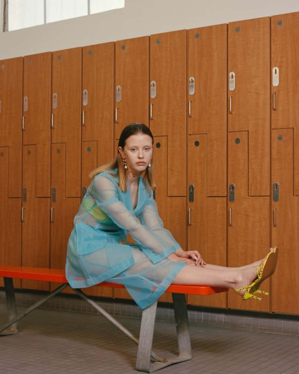 Mia Goth, sheer blue dress, red bench, SD Phone Wallpaper