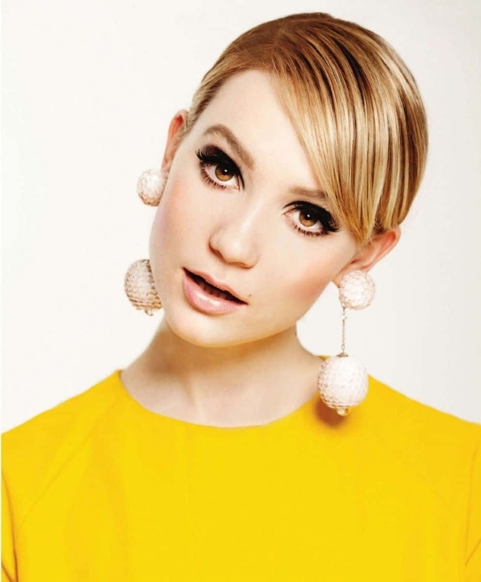 Mia Wasikowska, bright yellow top, large textured pearl earrings, SD Phone Wallpaper