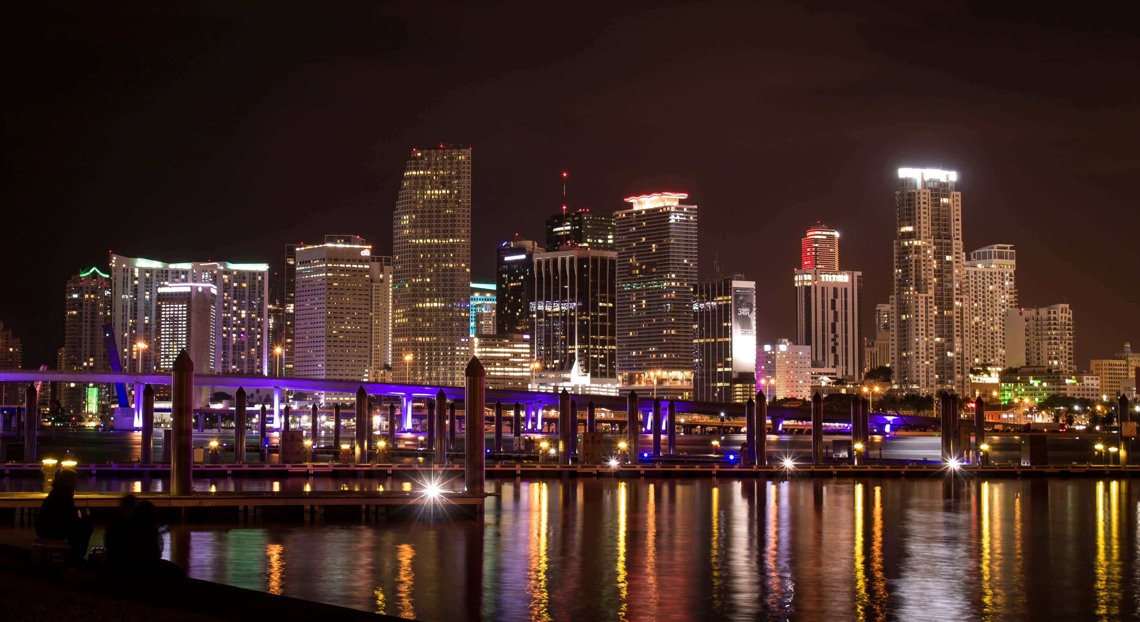 Miami, nighttime cityscape, illuminated skyscrapers, 2K Desktop Wallpaper