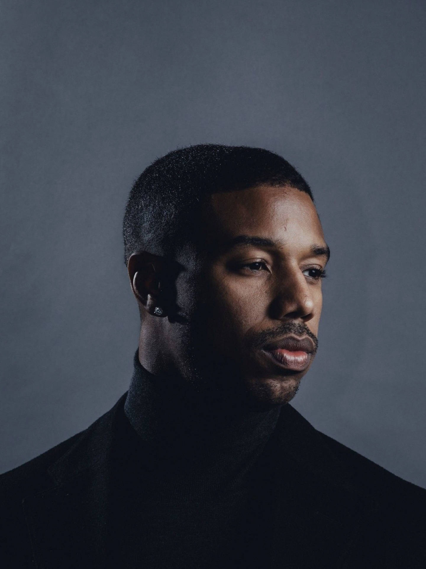 Michael B Jordan, black turtleneck, muted gray backdrop, Full HD Phone Wallpaper