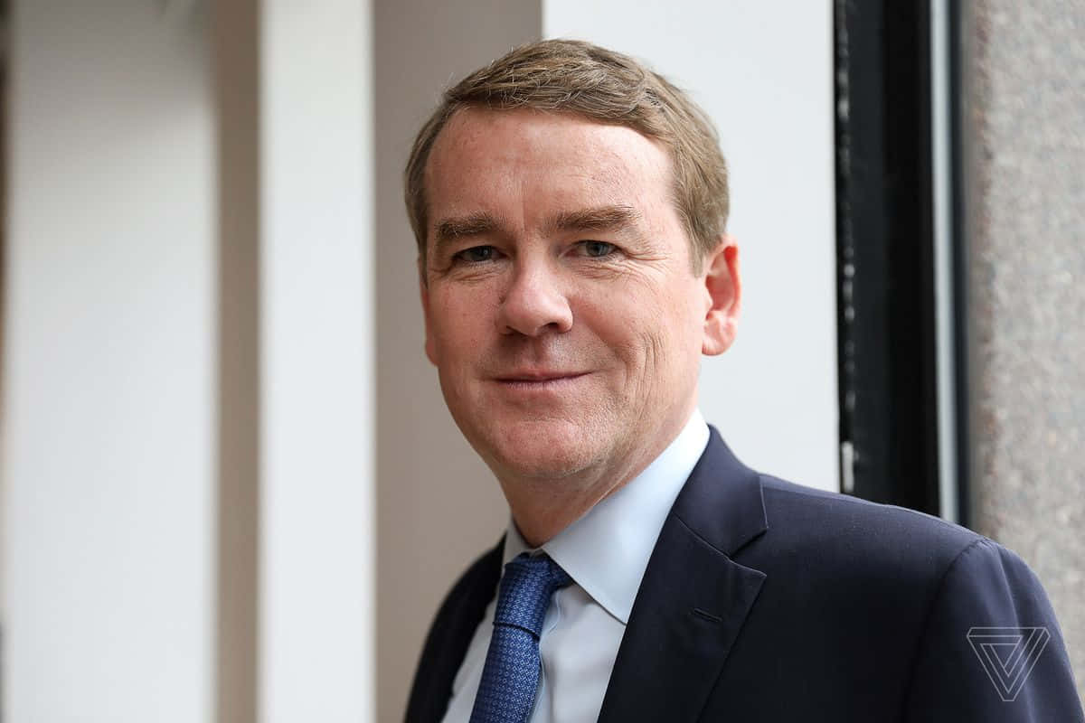Michael Bennet, dark suit, blue tie, SD Desktop Wallpaper