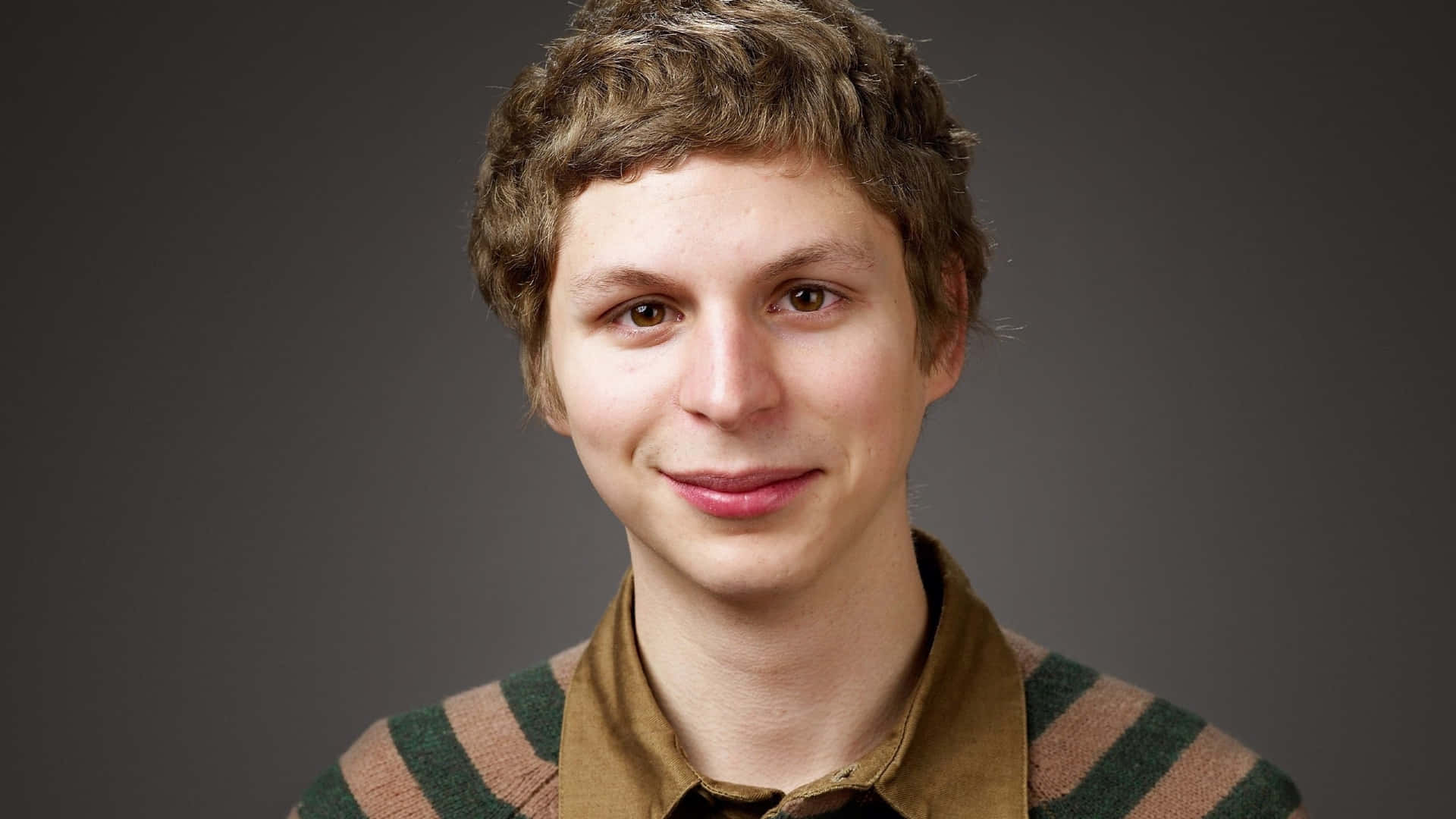 Michael Cera, curly brown hair, striped sweater, Full HD Desktop Wallpaper
