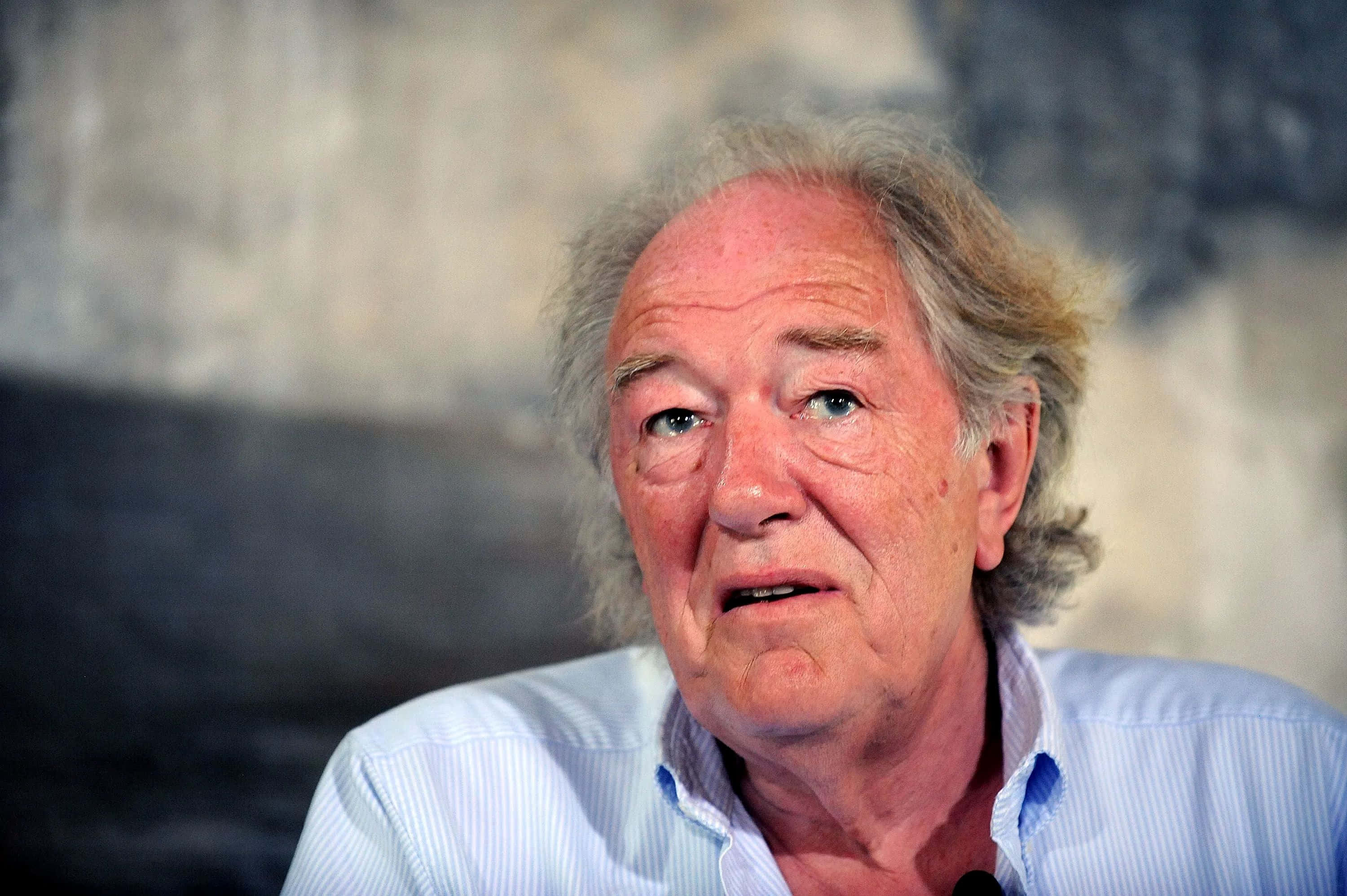 Michael Gambon, light blue striped shirt, gray background, 2K Desktop Wallpaper
