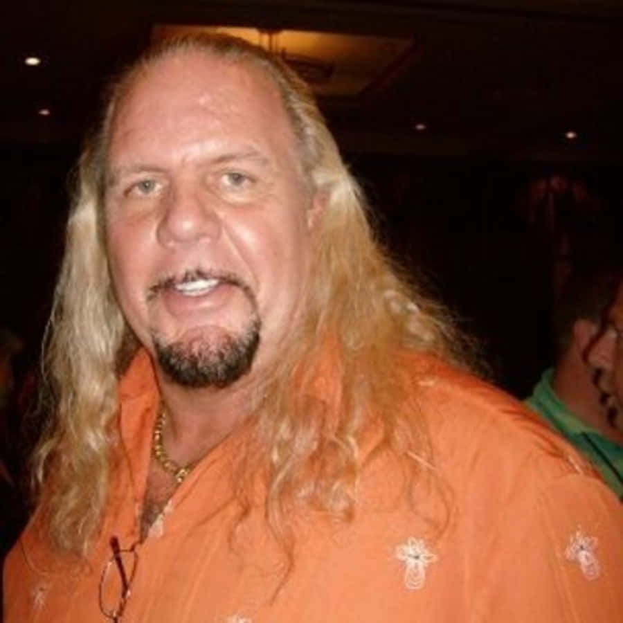 Michael Hayes, orange embroidered shirt, long blonde hair, SD Desktop Wallpaper