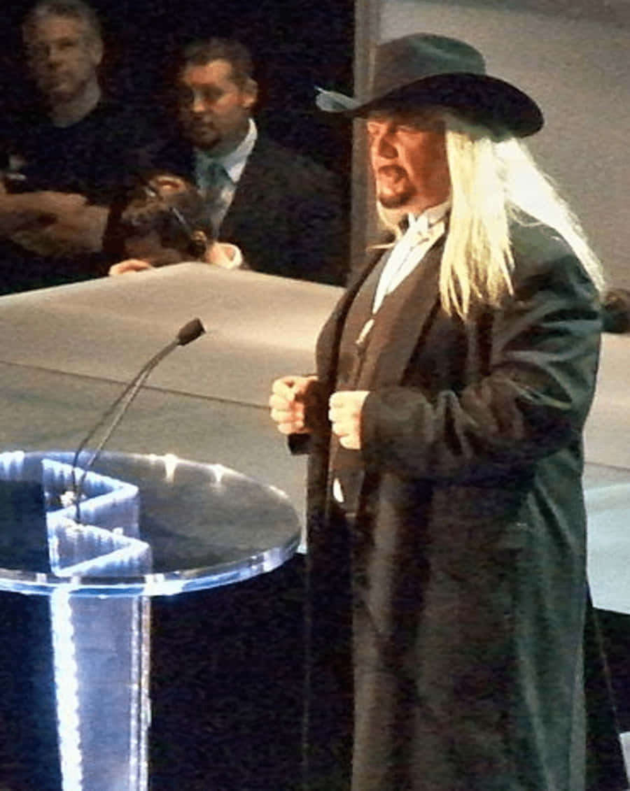 Michael Hayes, black cowboy hat, glowing blue podium, SD Phone Wallpaper