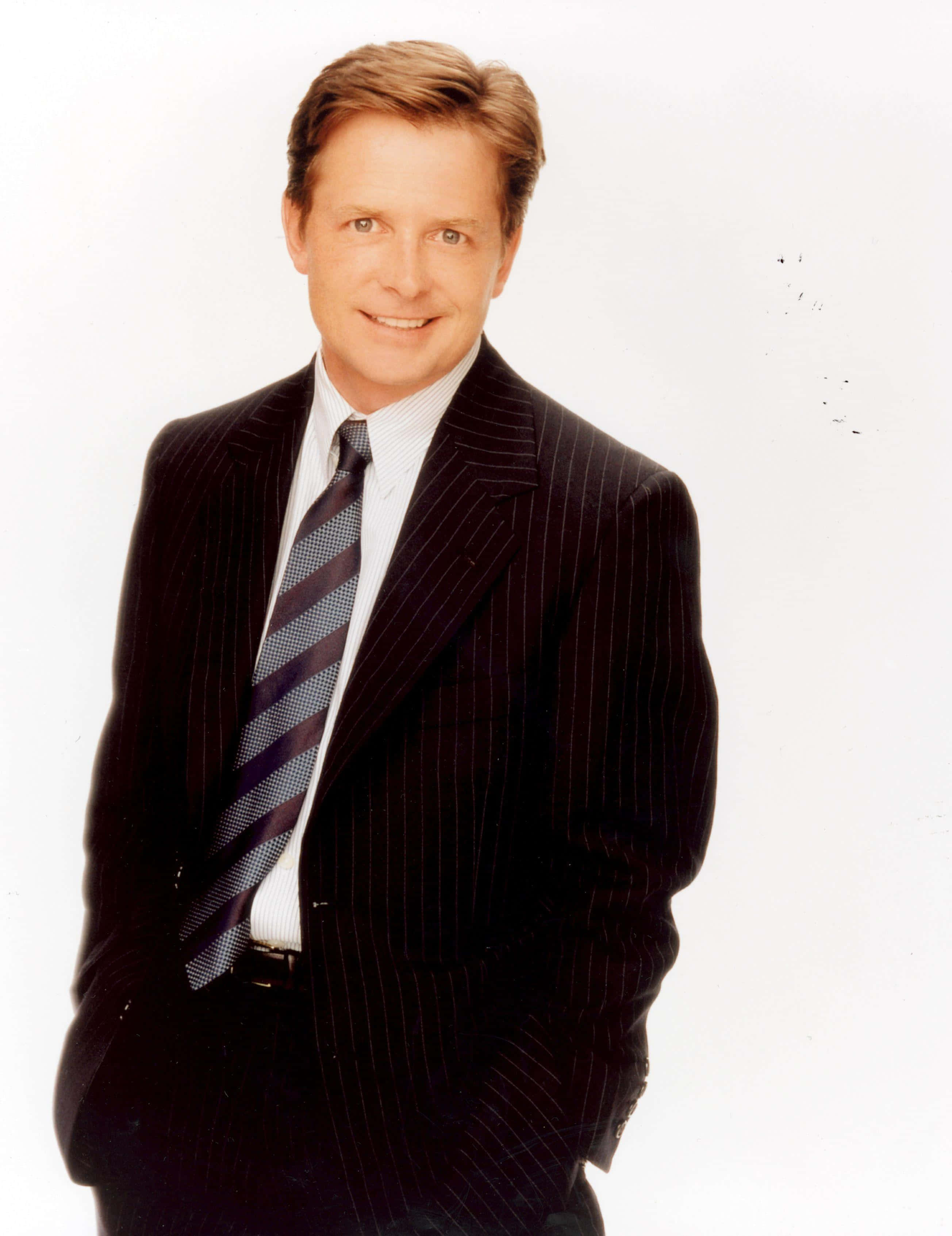 Michael J. Fox, dark pinstripe suit, striped tie, 2K Phone Wallpaper