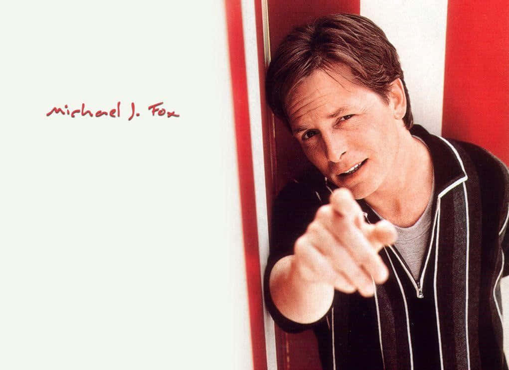 Michael J. Fox, red and white striped walls, playful smirk, SD Desktop Wallpaper