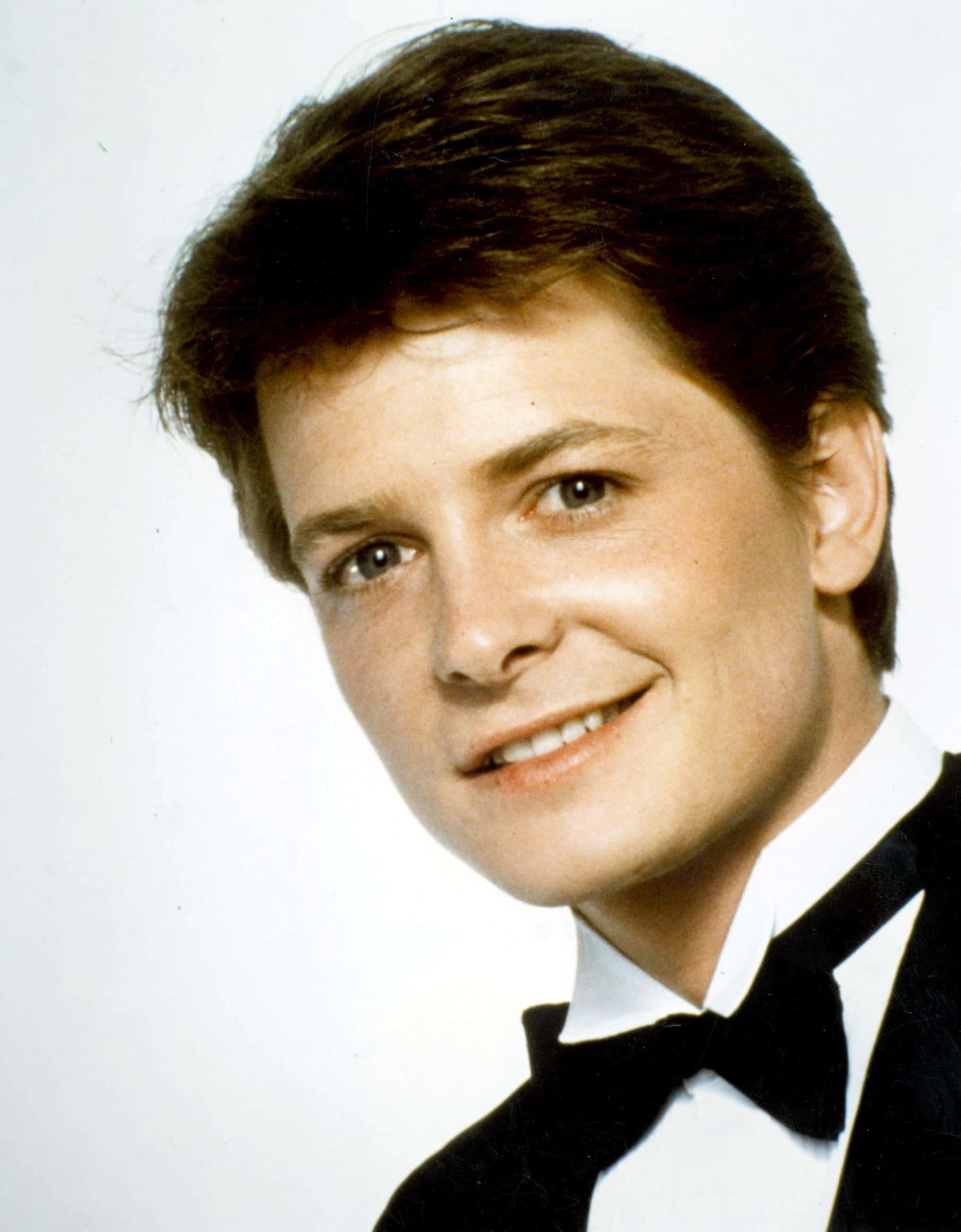Michael J Fox, black tuxedo, plain white background, 2K Phone Wallpaper