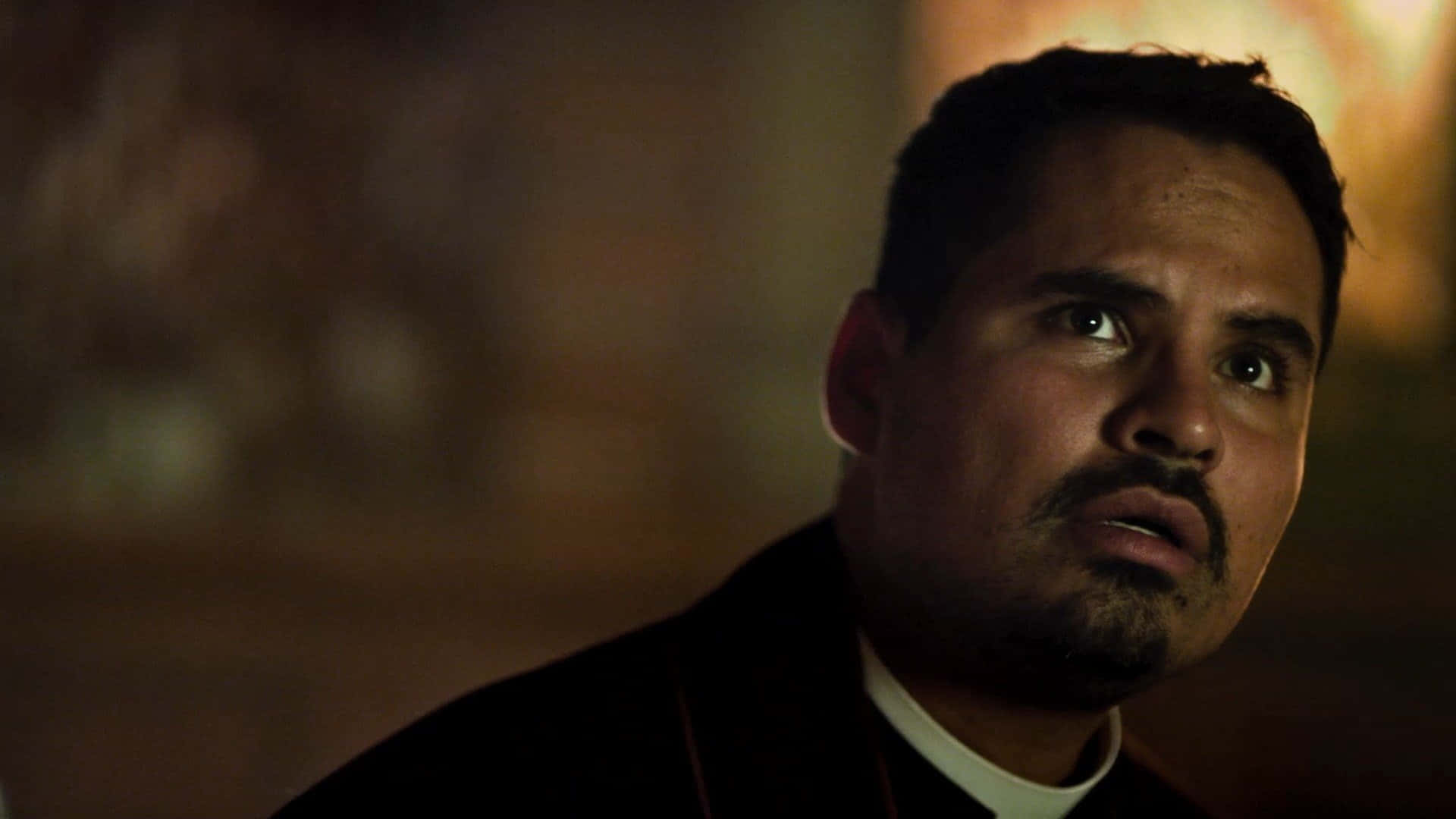 Michael Peña, priest's collar, warm dim lighting, Full HD Desktop Wallpaper
