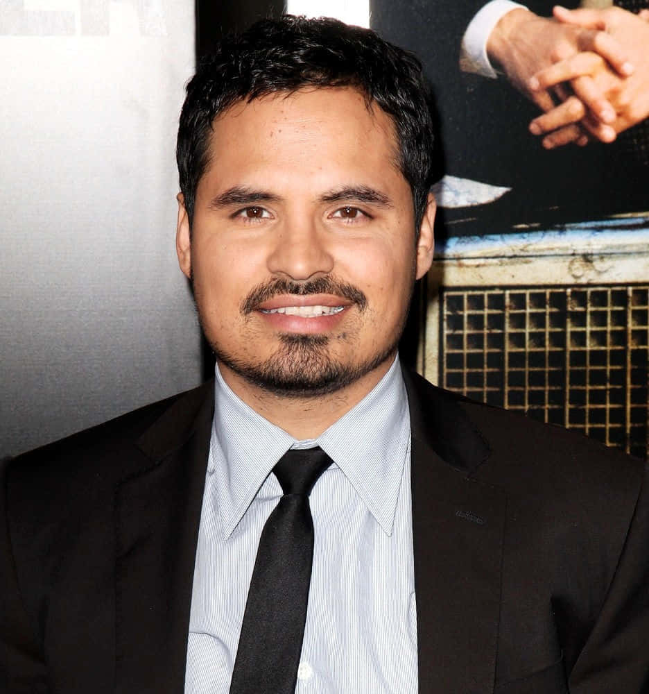 Michael Peña, black suit and tie, blurred event backdrop, SD Phone Wallpaper
