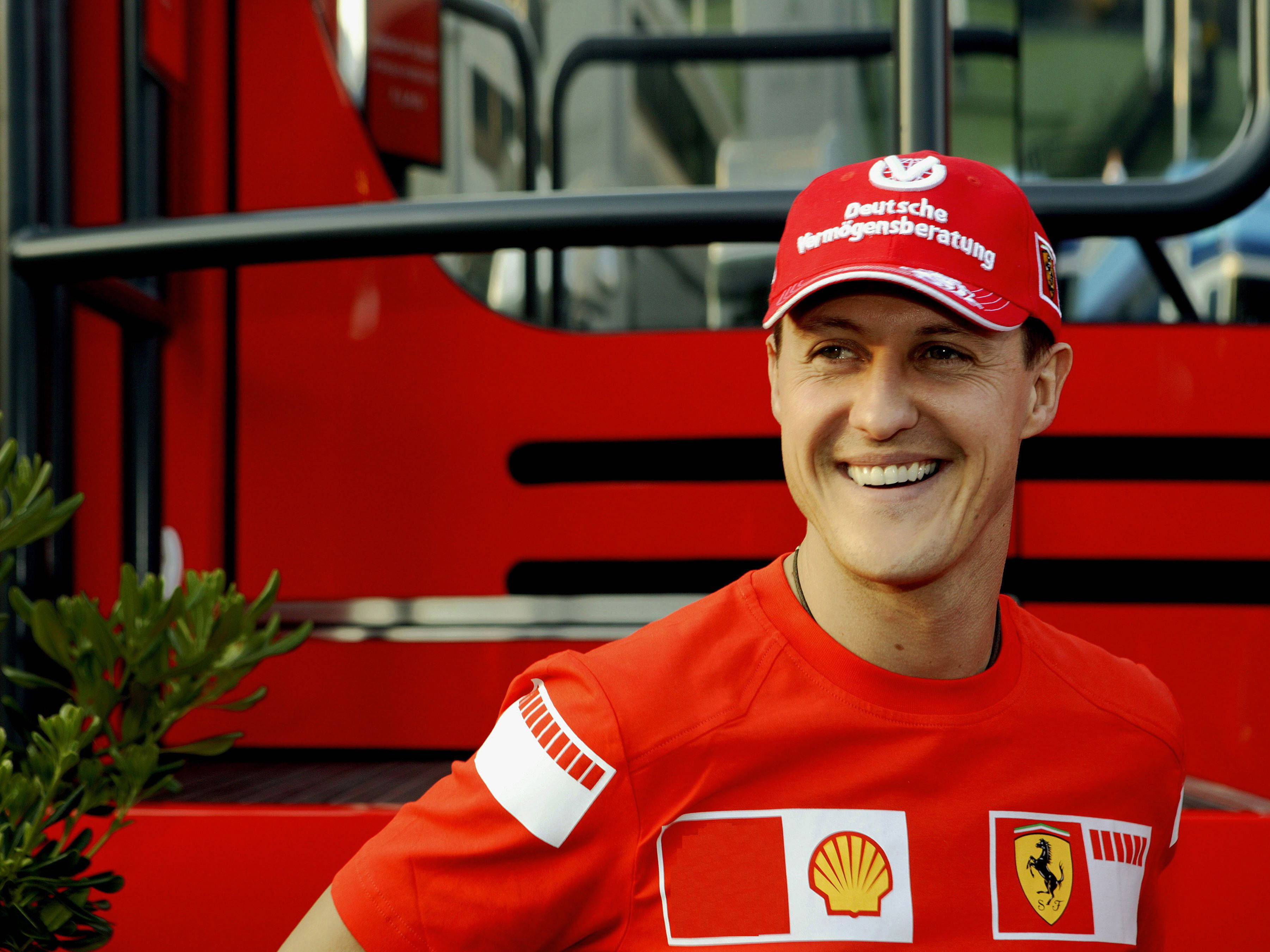 Michael Schumacher, red Ferrari team shirt, red bus, 2K Desktop Wallpaper