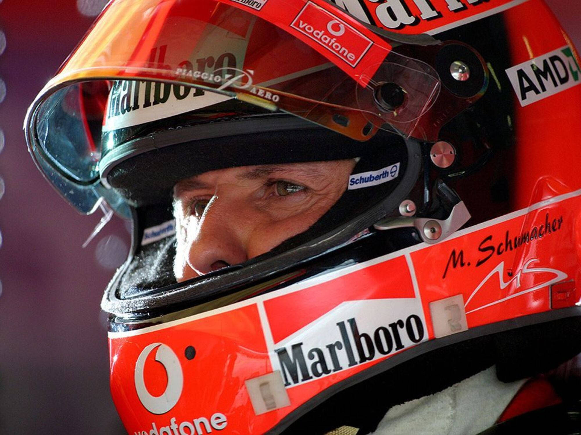 Michael Schumacher, red McLaren Formula 1 helmet, sponsor logos, Full HD Desktop Wallpaper