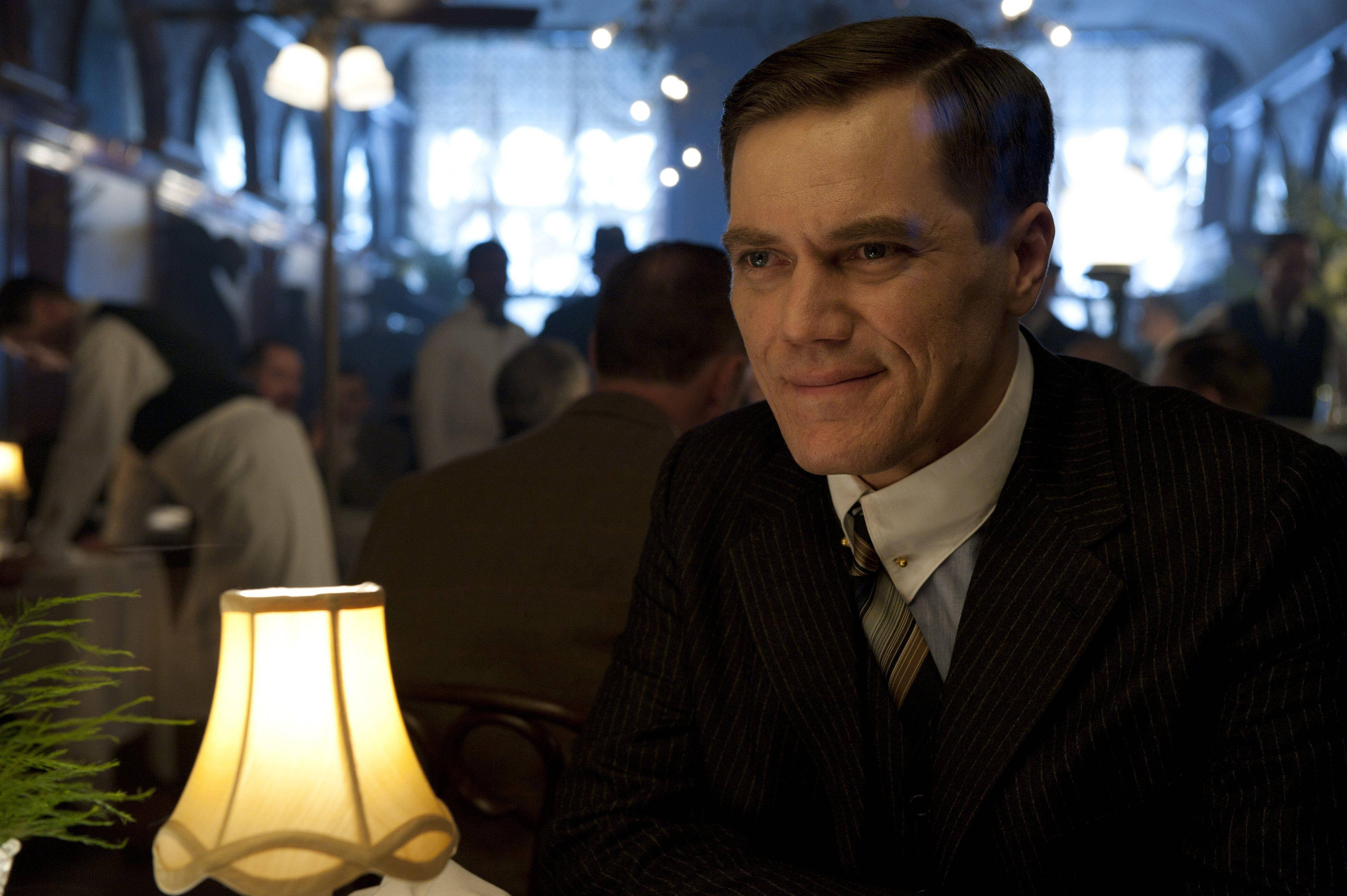 Michael Shannon, pinstripe suit, dimly lit vintage restaurant, 4K Desktop Wallpaper