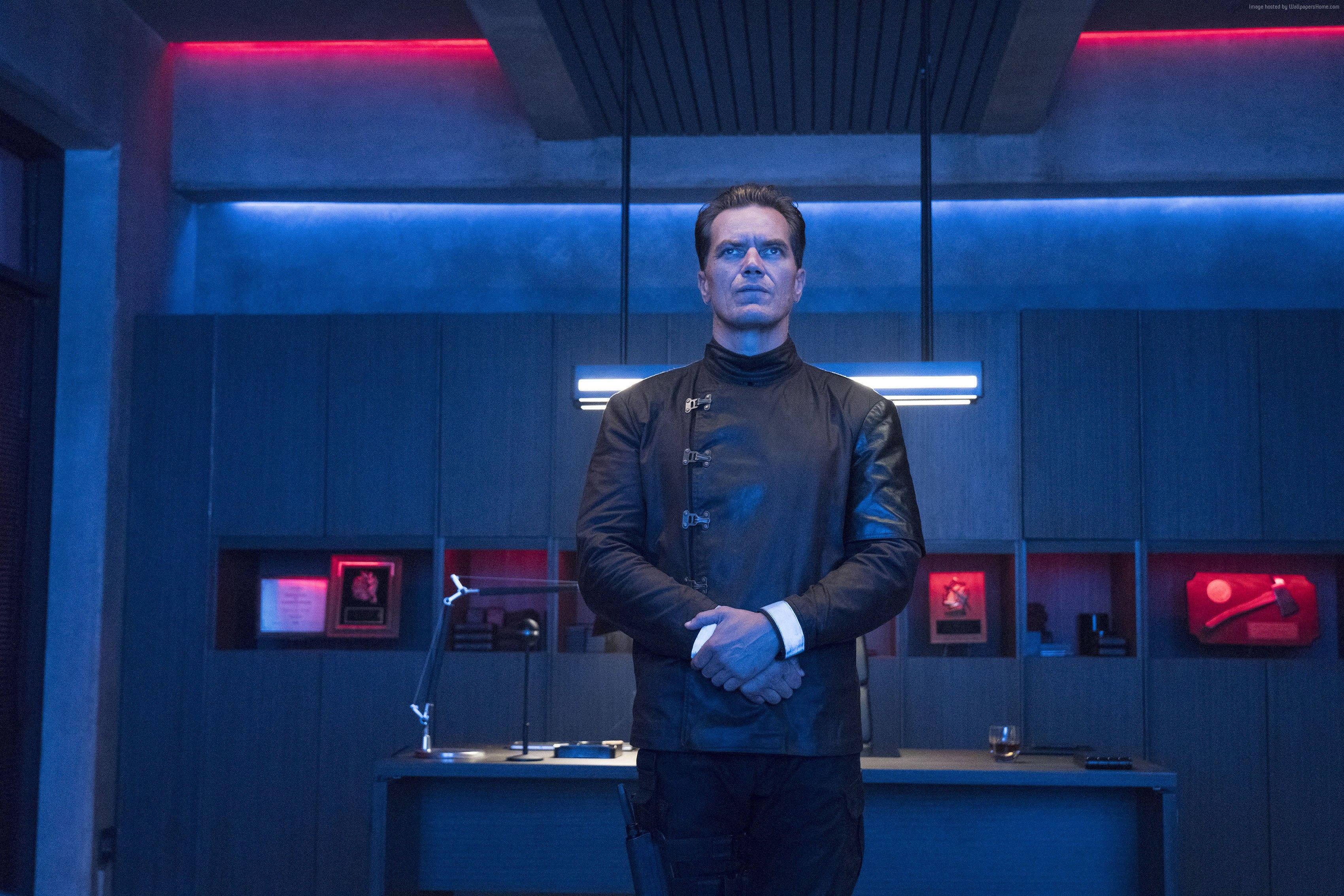 Michael Shannon, black leather jacket, dimly lit futuristic office, 2K Desktop Wallpaper