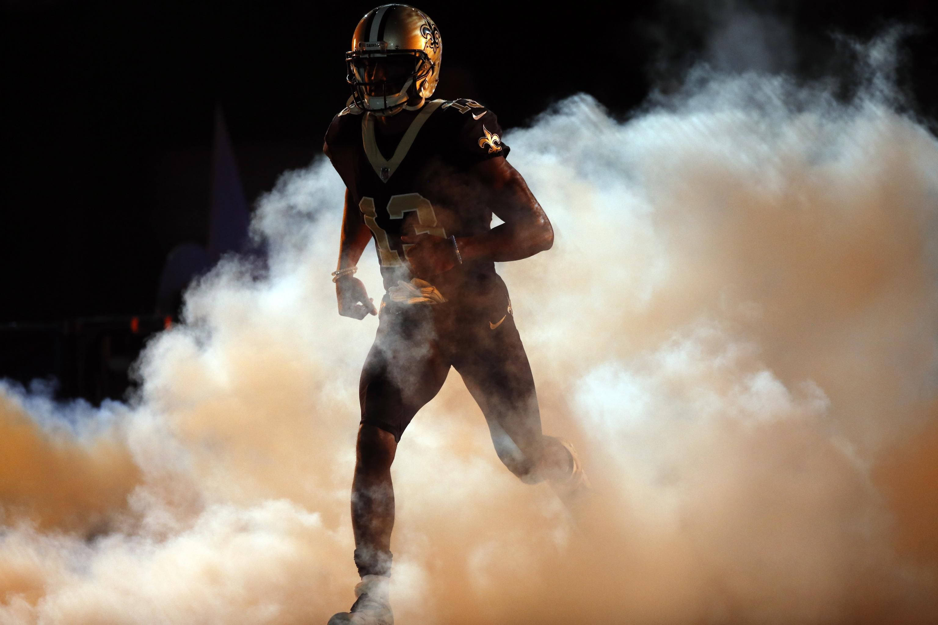 Michael Thomas, gold and black uniform, orange smoke tunnel, 2K Desktop Wallpaper
