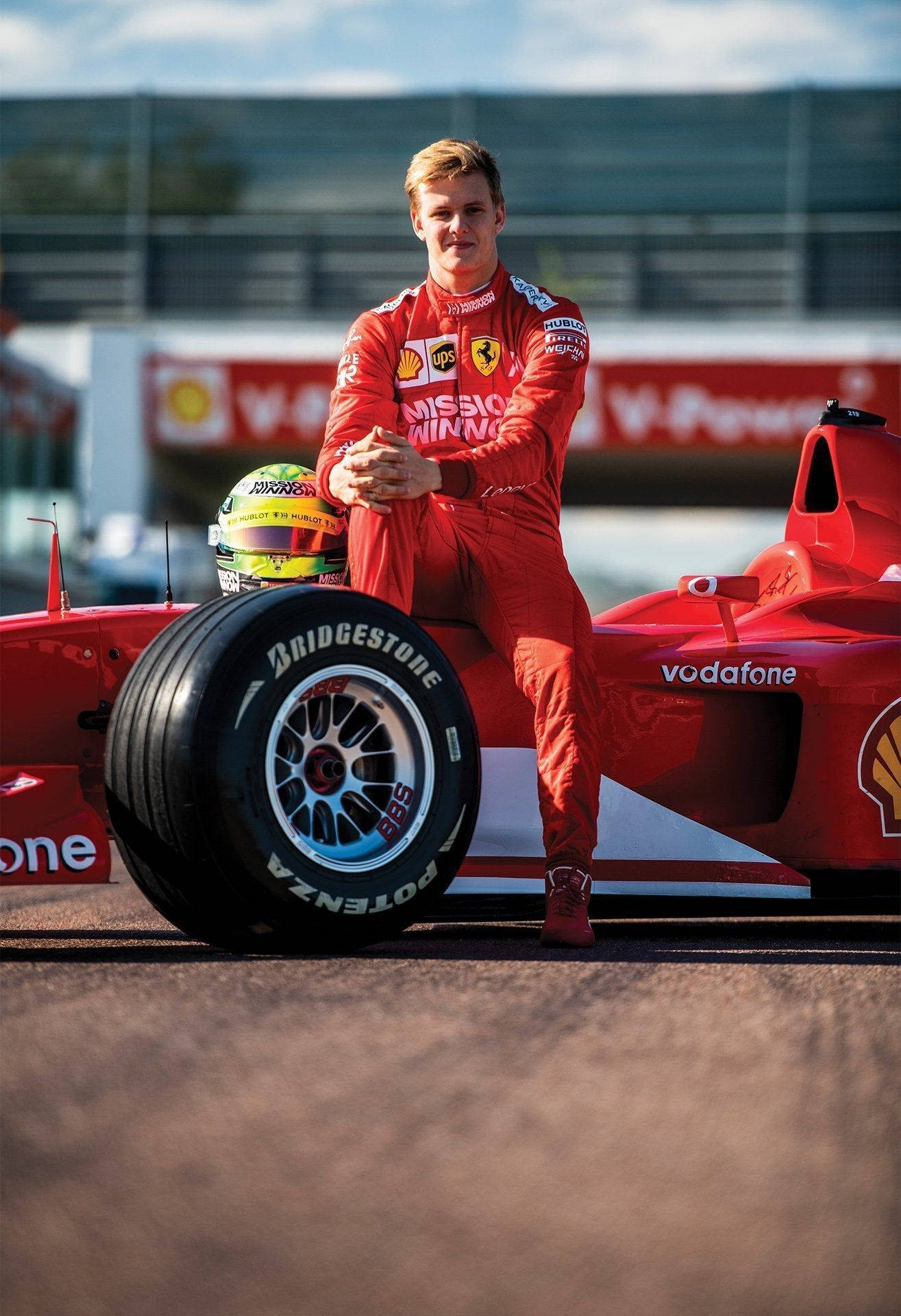 Mick Schumacher, red Ferrari suit, red Formula 1 car, Full HD Phone Wallpaper