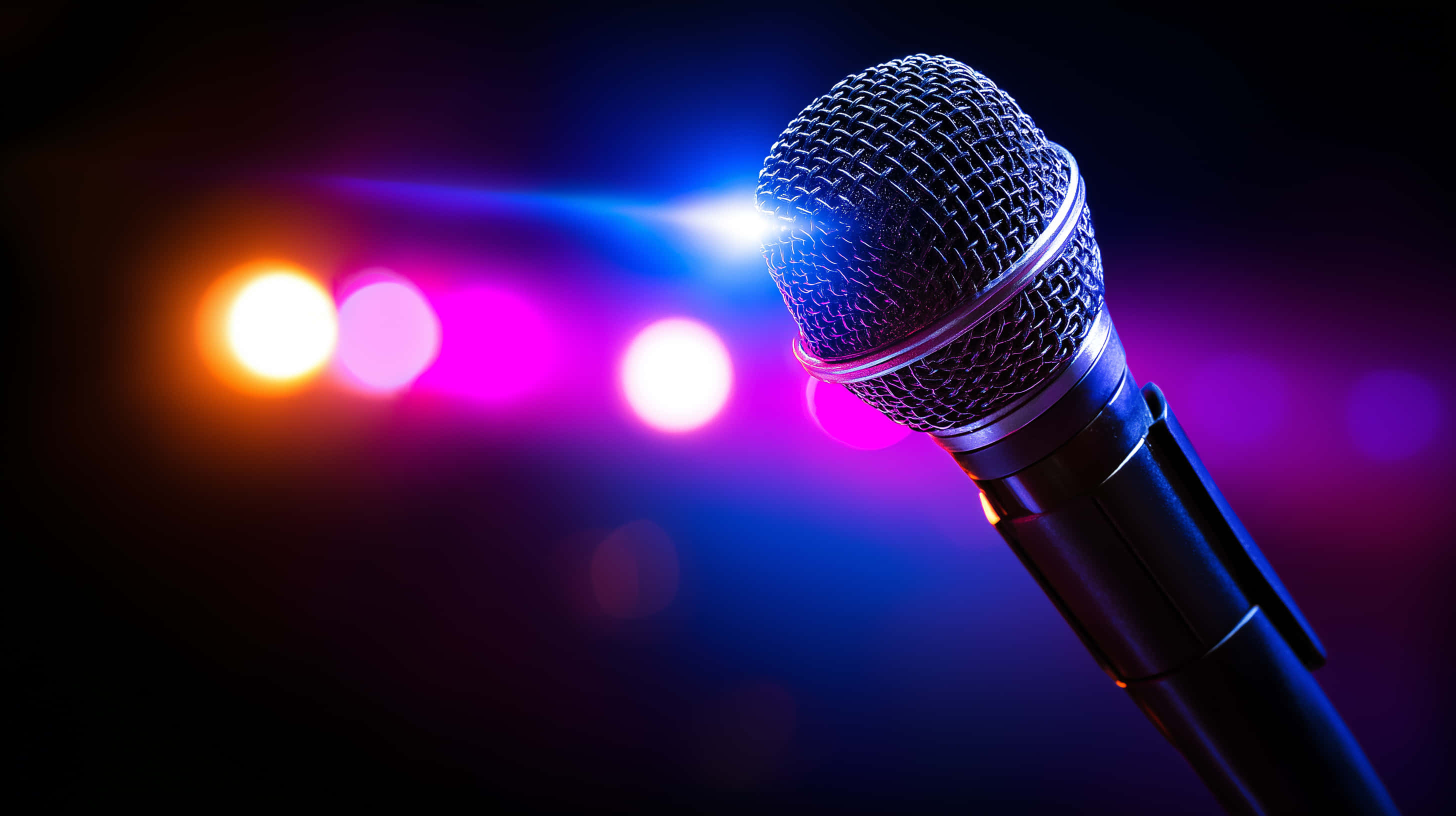 black microphone, mesh grille, dark background, 2K Desktop Wallpaper