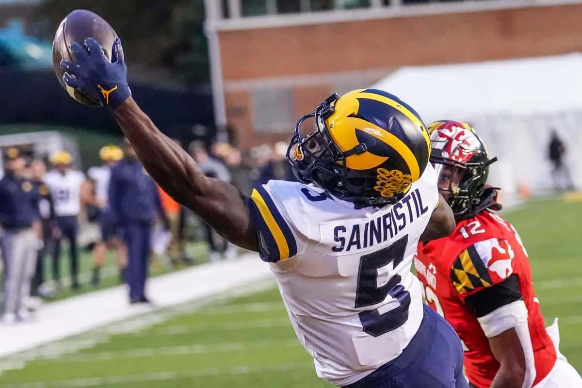 Mike Sainristil, white and blue uniform, football, SD Desktop Wallpaper