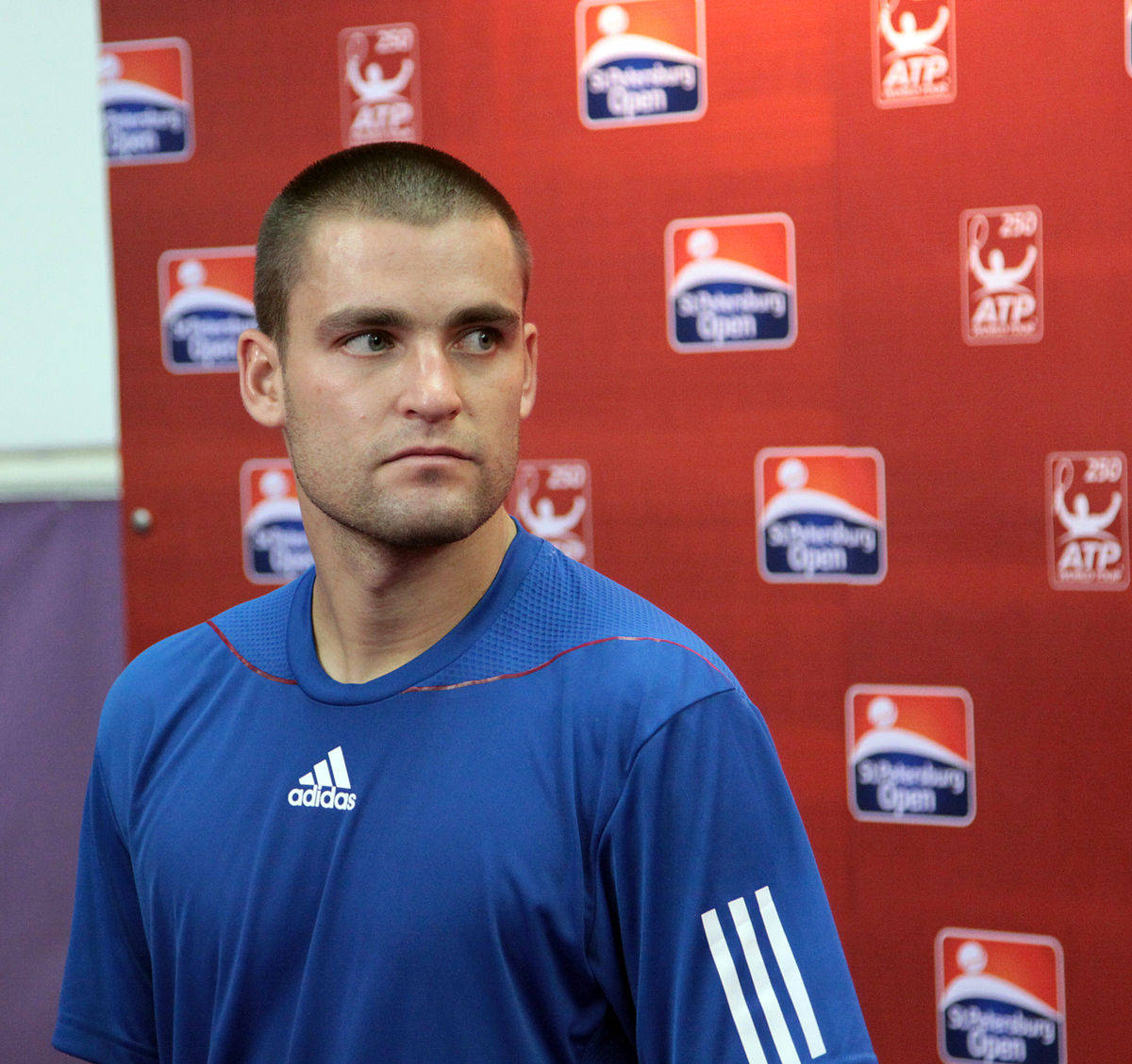 Mikhail Youzhny, blue adidas shirt, red ATP tournament backdrop, SD Desktop Wallpaper
