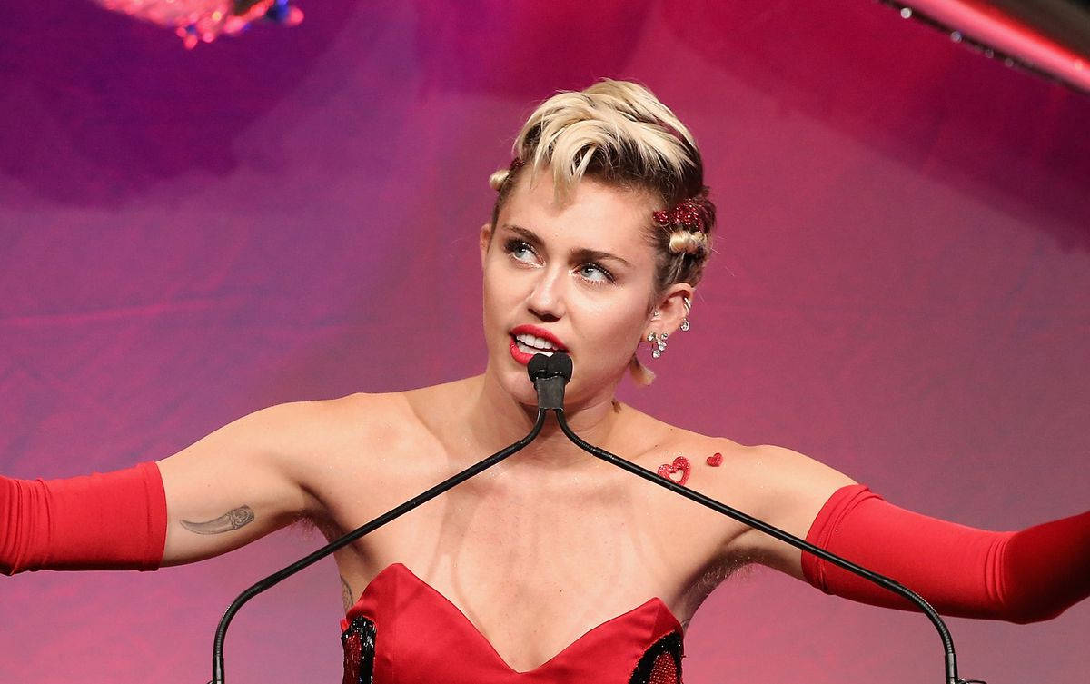 Miley Cyrus, bold red outfit, vibrant pink backdrop, SD Desktop Wallpaper
