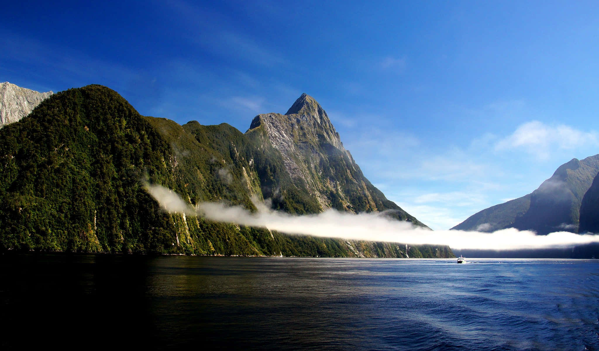 Milford Sound, steep forested mountains, low cloud layer, Full HD Desktop Wallpaper