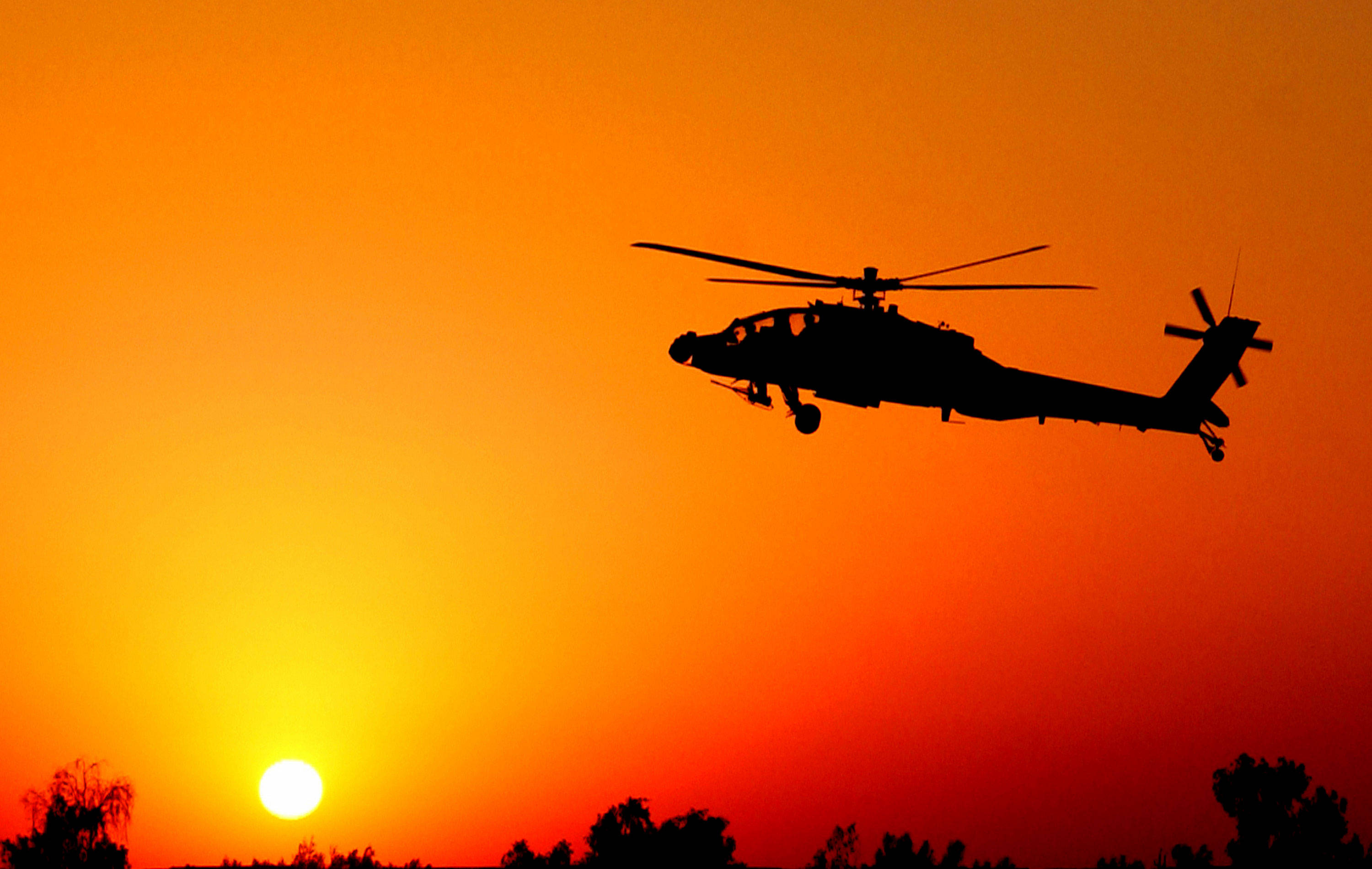 military helicopter, fiery orange sunset sky, bright sun, 2K Desktop Wallpaper
