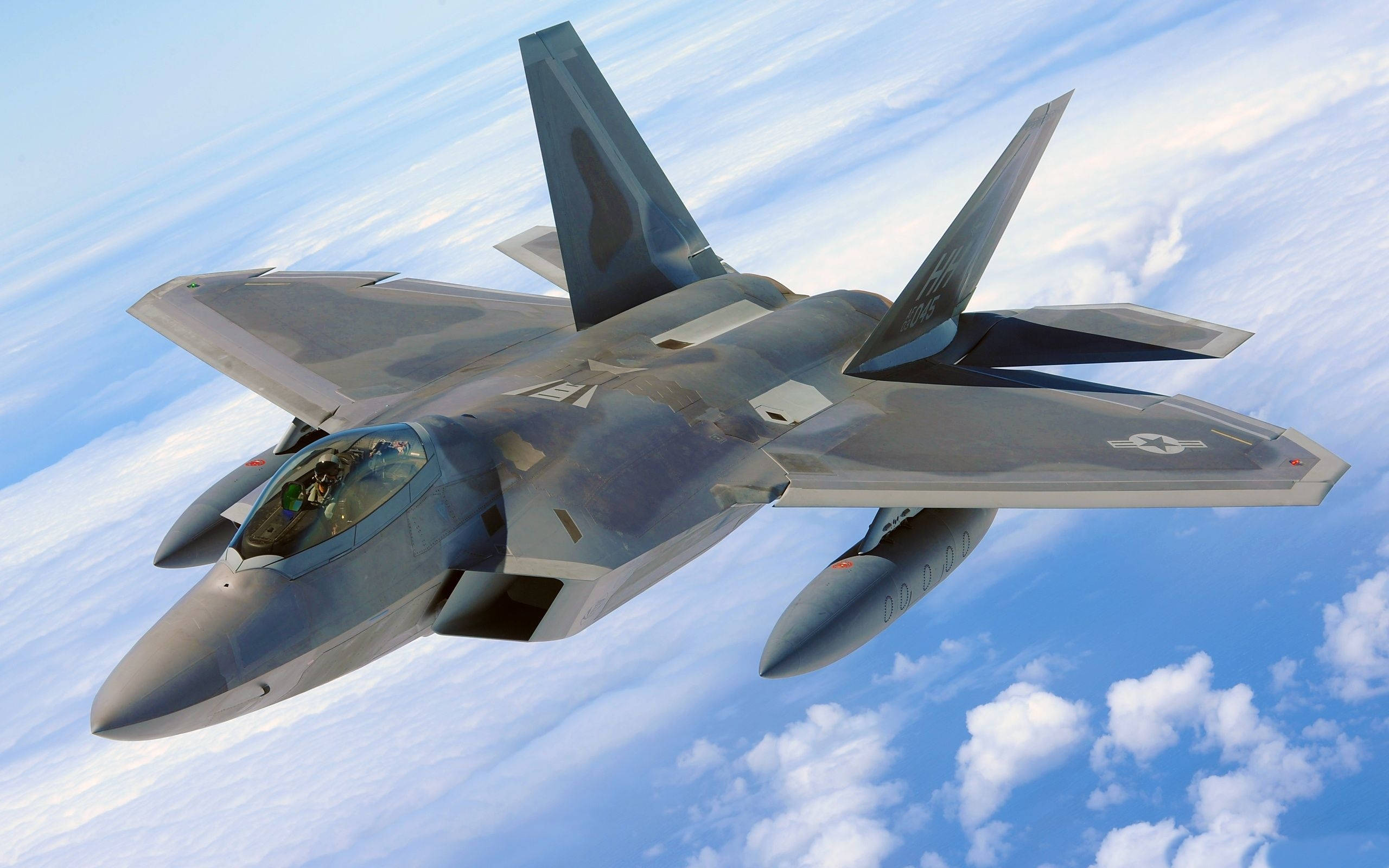 sleek gray fighter jet, bright blue sky, fluffy white clouds, 2K Desktop Wallpaper
