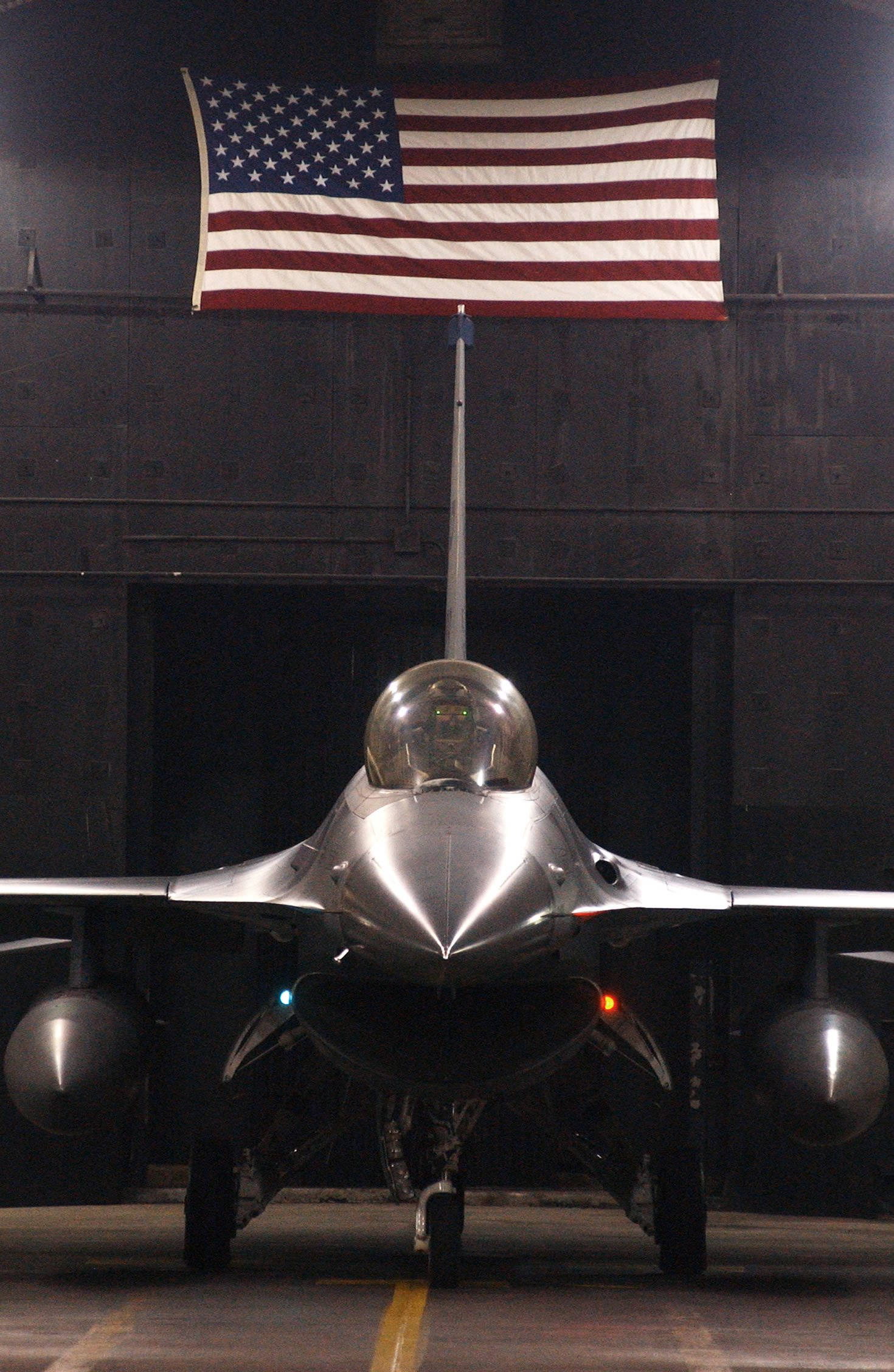 American flag, sleek silver fighter jet, dim hangar, Full HD Phone Wallpaper
