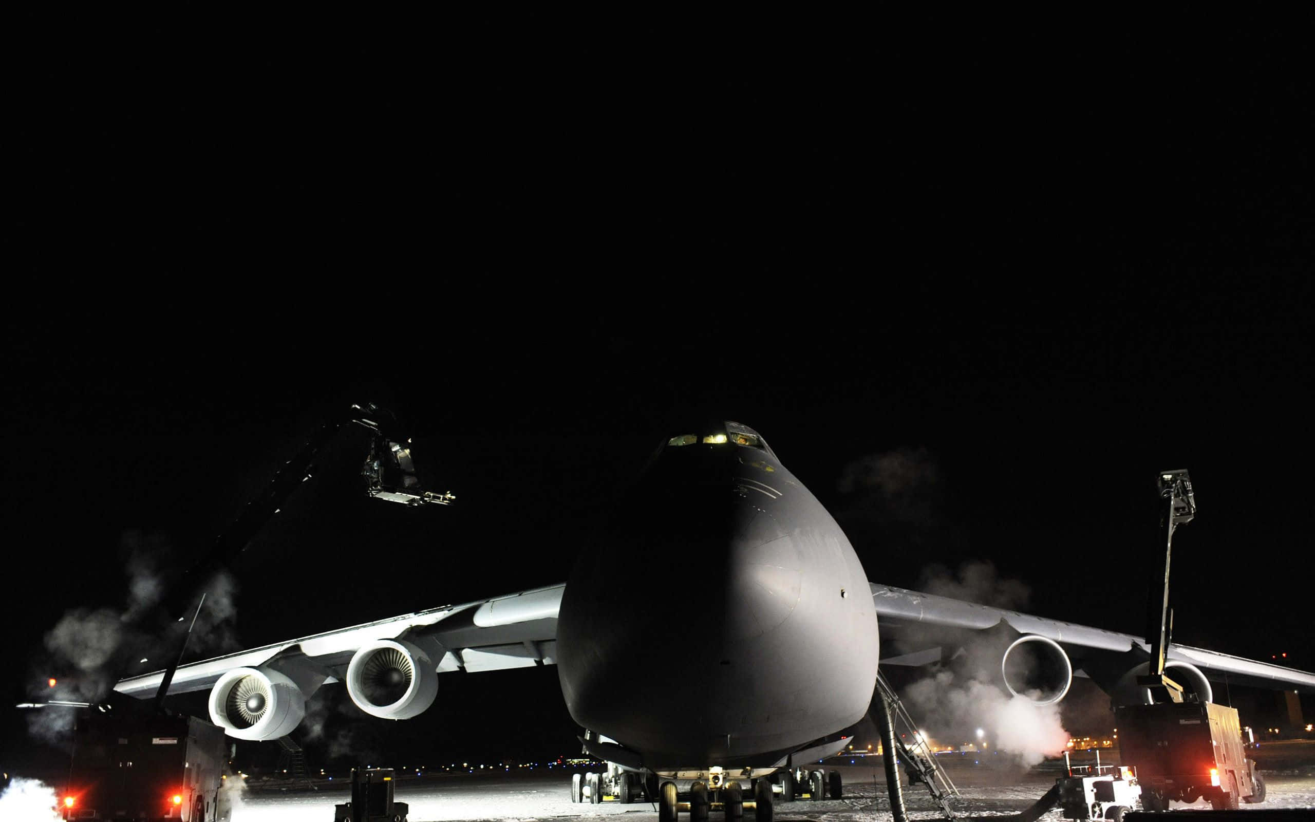 military transport plane, night, snowy tarmac, 2K Desktop Wallpaper