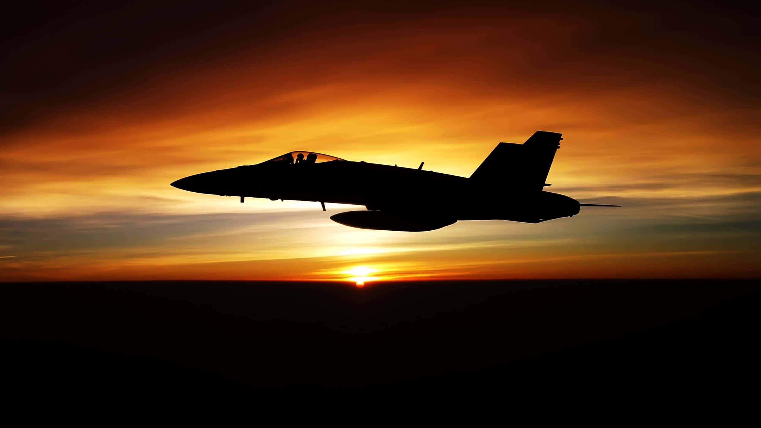 fighter jet, fiery sunset sky, glowing orange and yellow clouds, 2K Desktop Wallpaper