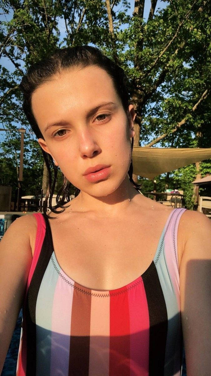 Millie Bobby Brown, golden hour, striped swimsuit, SD Phone Wallpaper