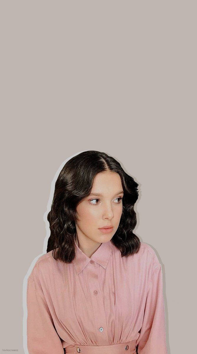 Millie Bobby Brown, pink button-up shirt, dark wavy hair, SD Phone Wallpaper