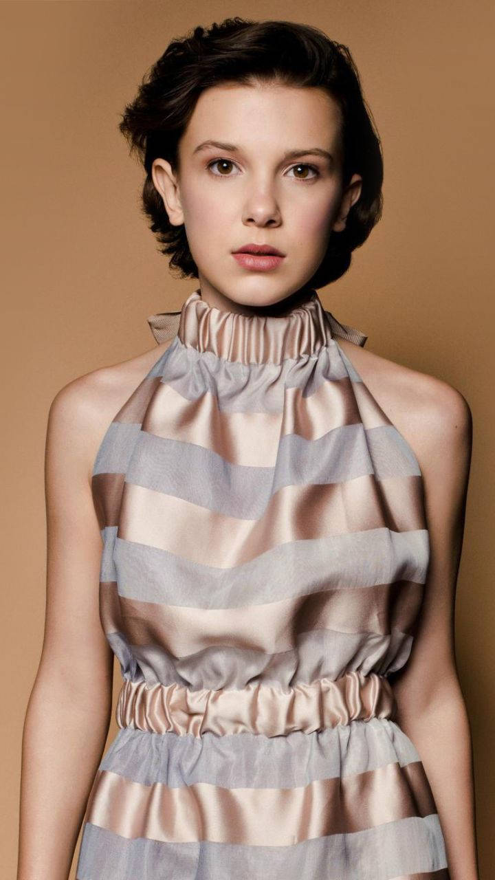 Millie Bobby Brown, short dark hair, high-necked striped dress, HD Phone Wallpaper