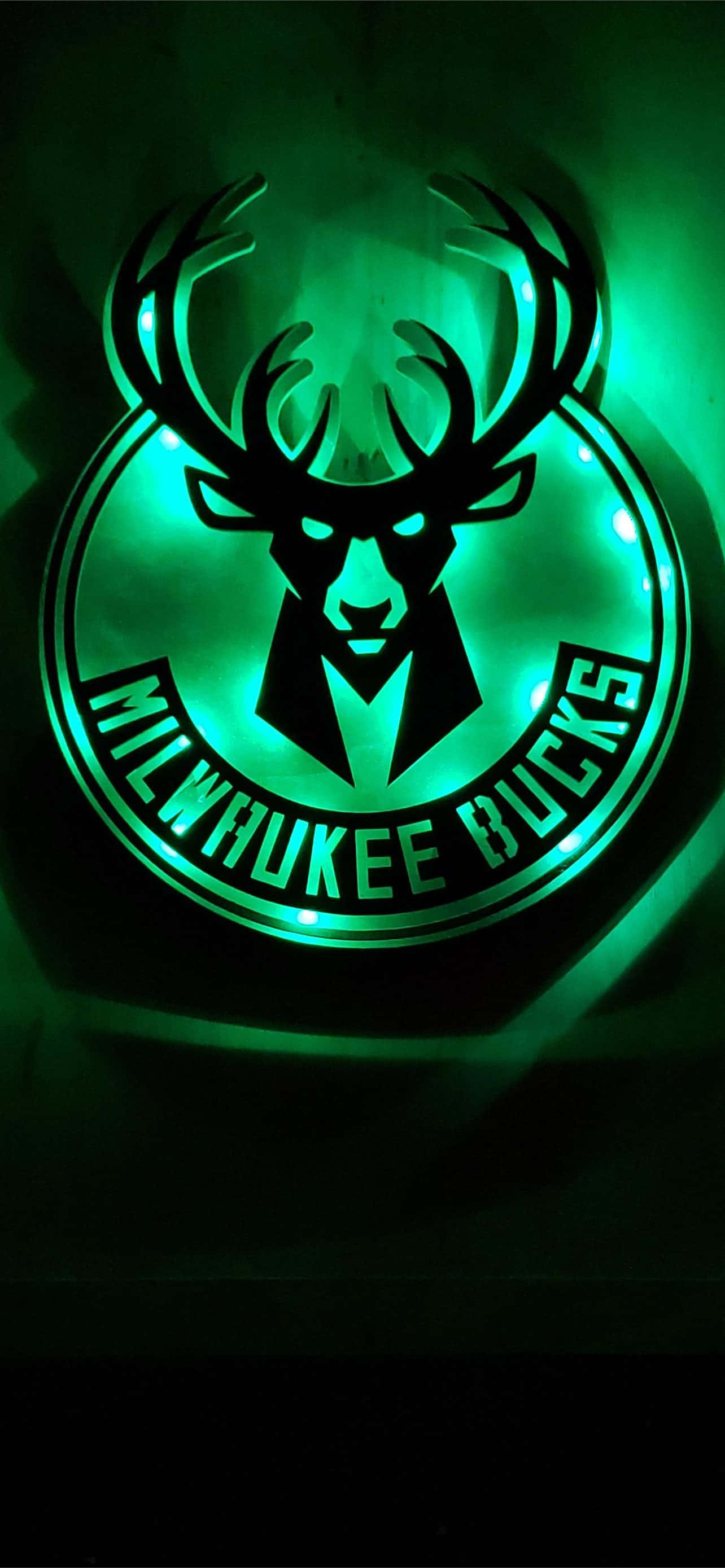 Milwaukee Bucks logo, glowing green, dark room, 2K Phone Wallpaper