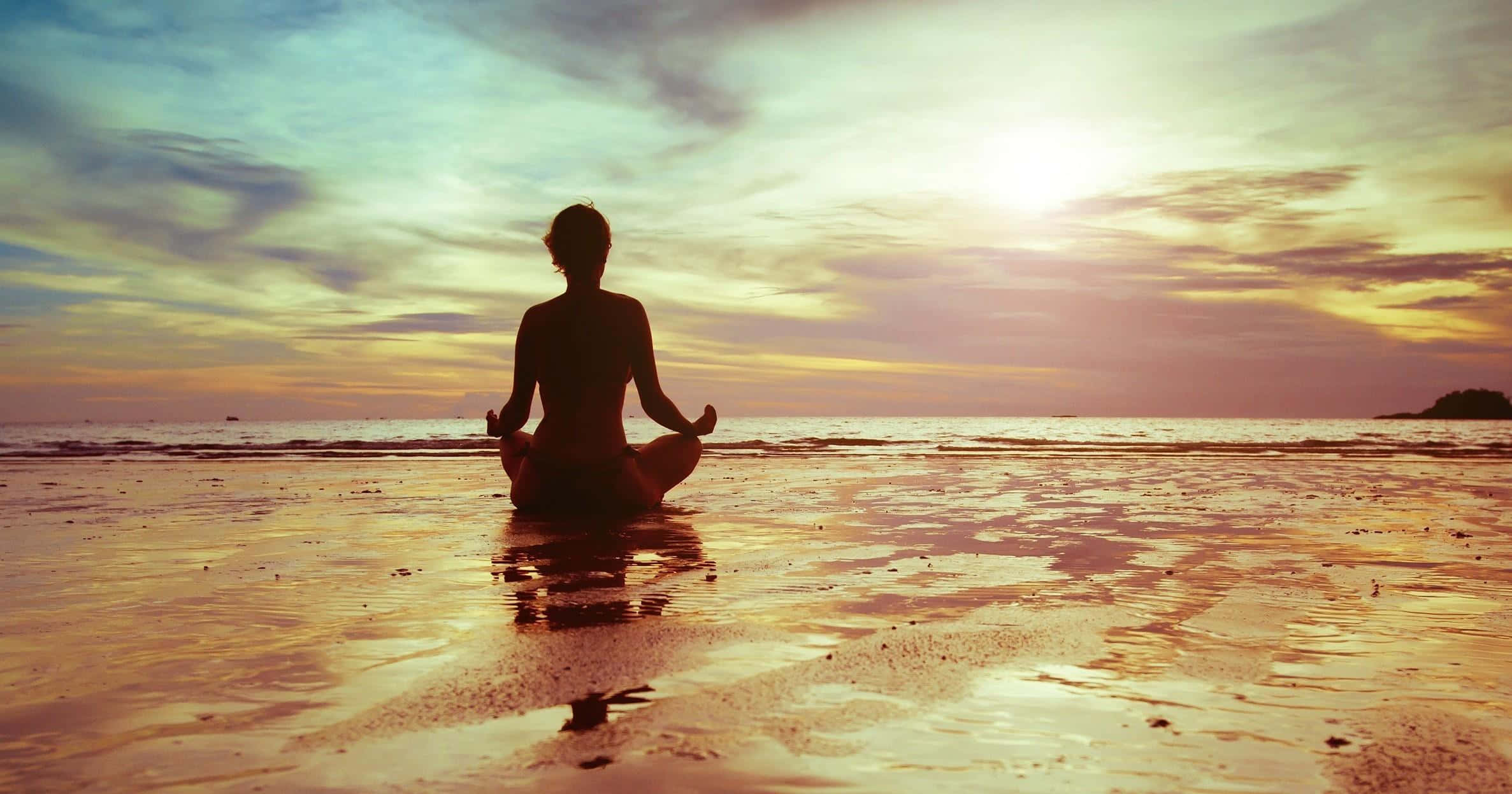 silhouette, person meditating cross-legged, wet sand, Full HD Desktop Wallpaper