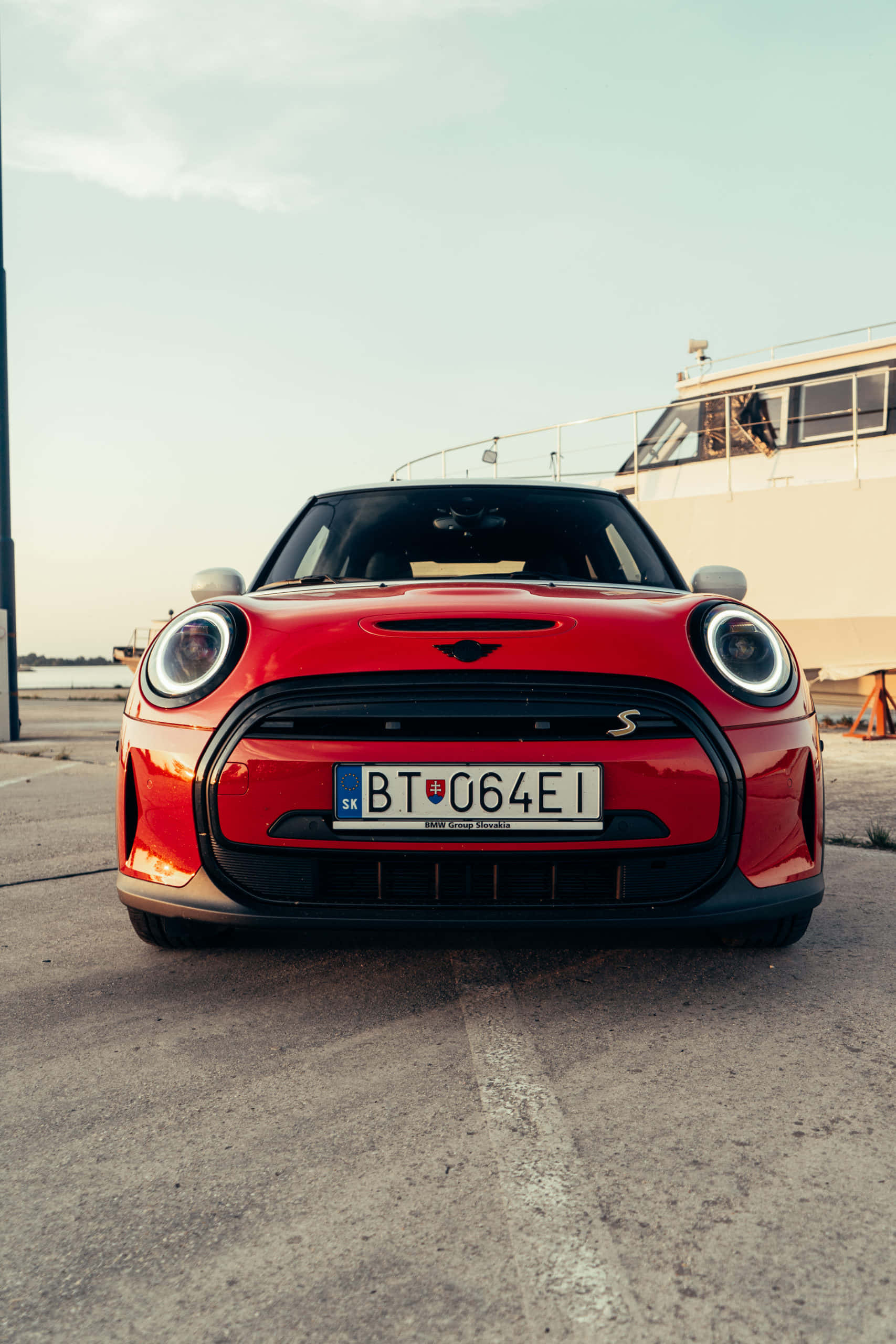 Red Mini Cooper S E, front view, concrete dock, 2K Phone Wallpaper