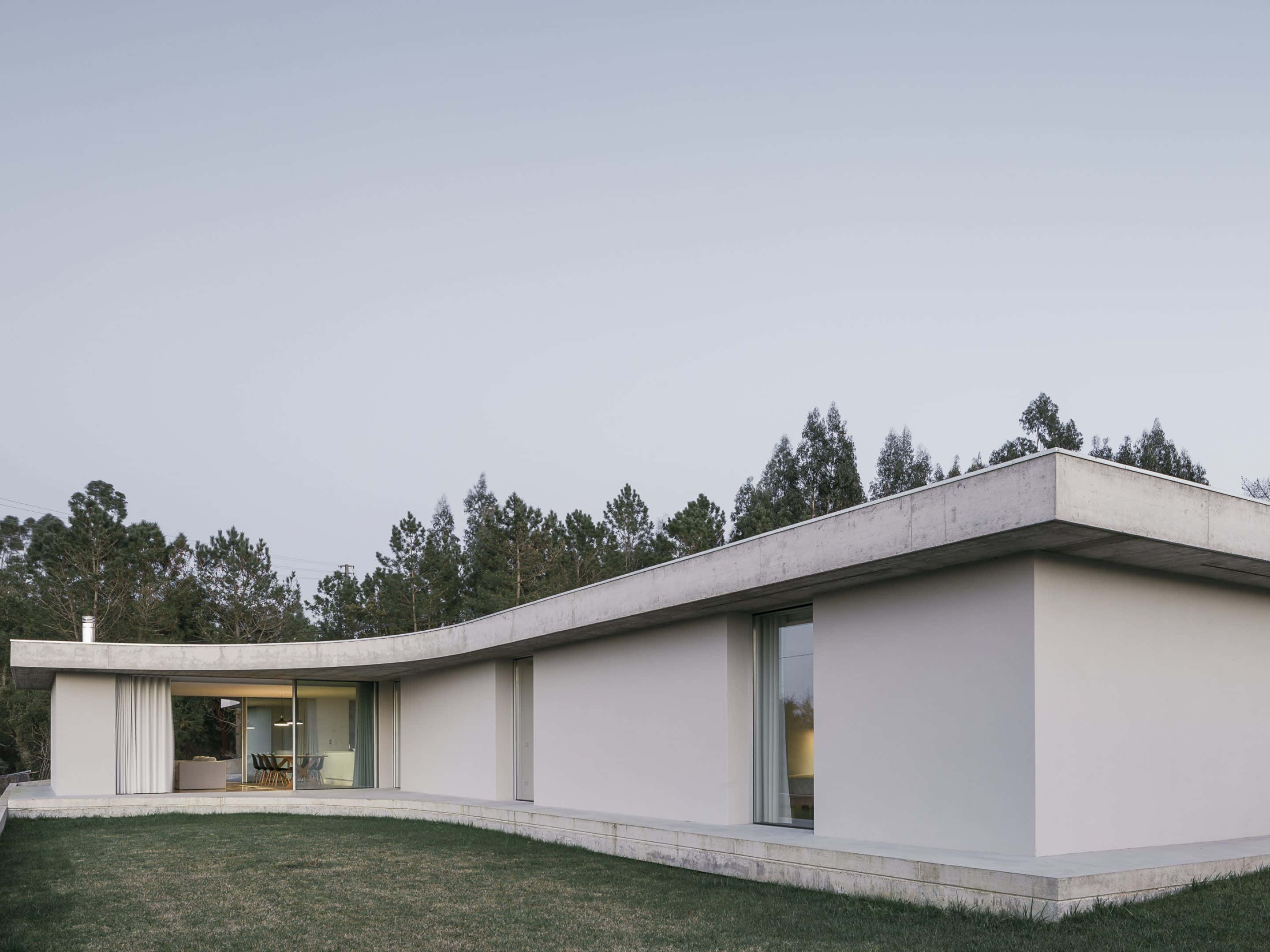modern minimalist architecture, sleek modernist concrete house, curved walls, 2K Desktop Wallpaper